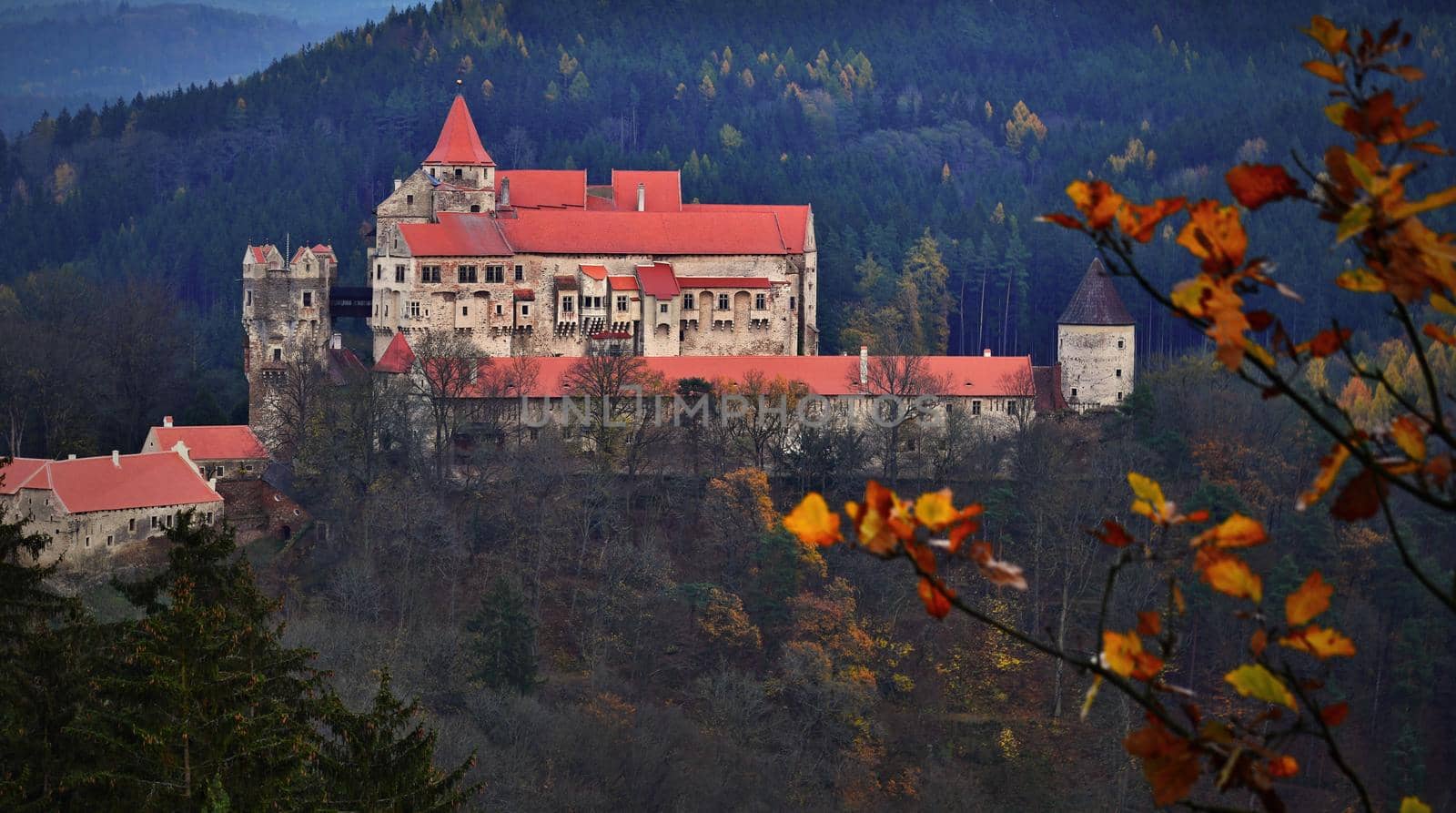 Beautiful old castle in forests with autumn landscape. Castle Pernstejn - Nedvedice. Europe Czech Republic.