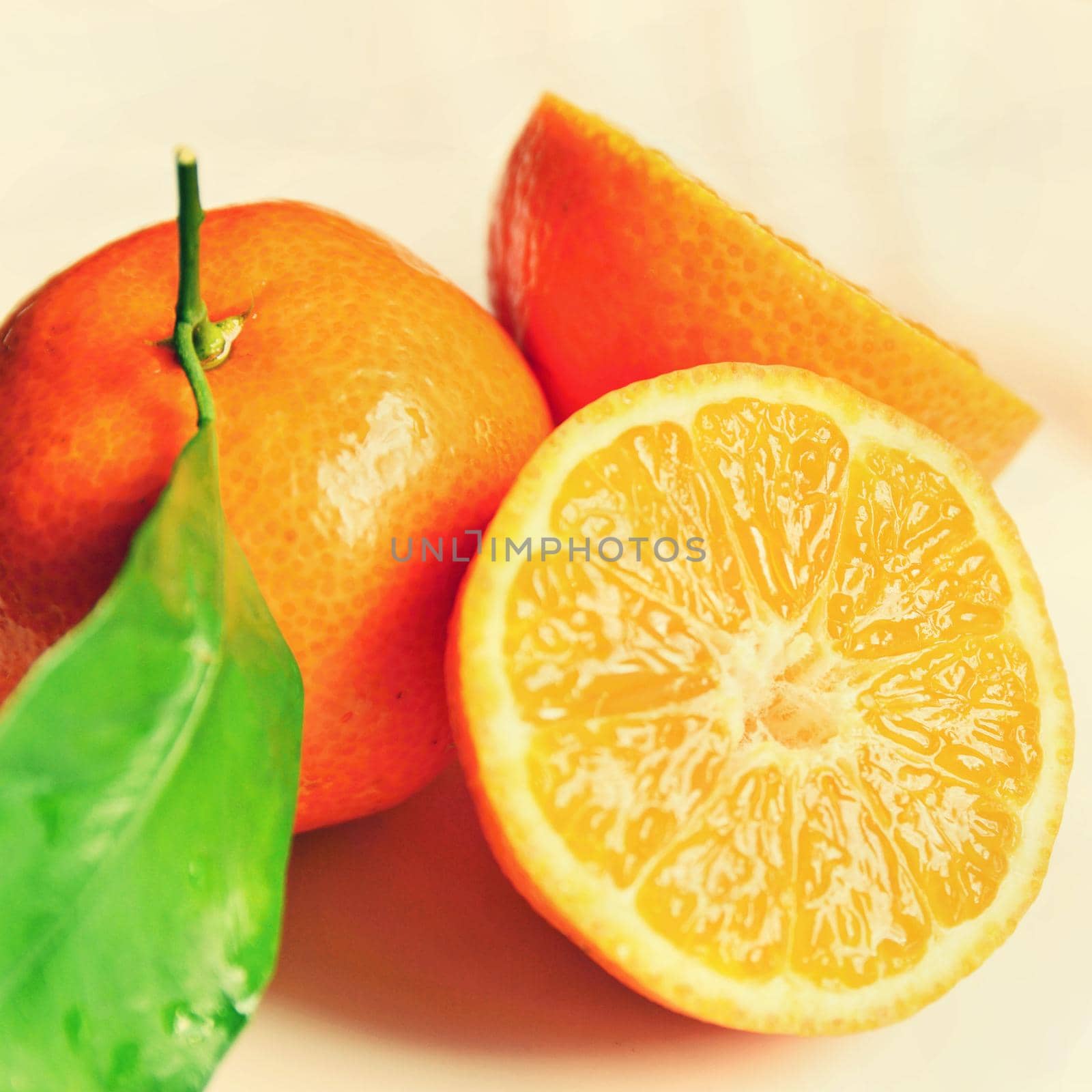 Beautiful fresh fruit - tangerine. Isolated on a clean background.