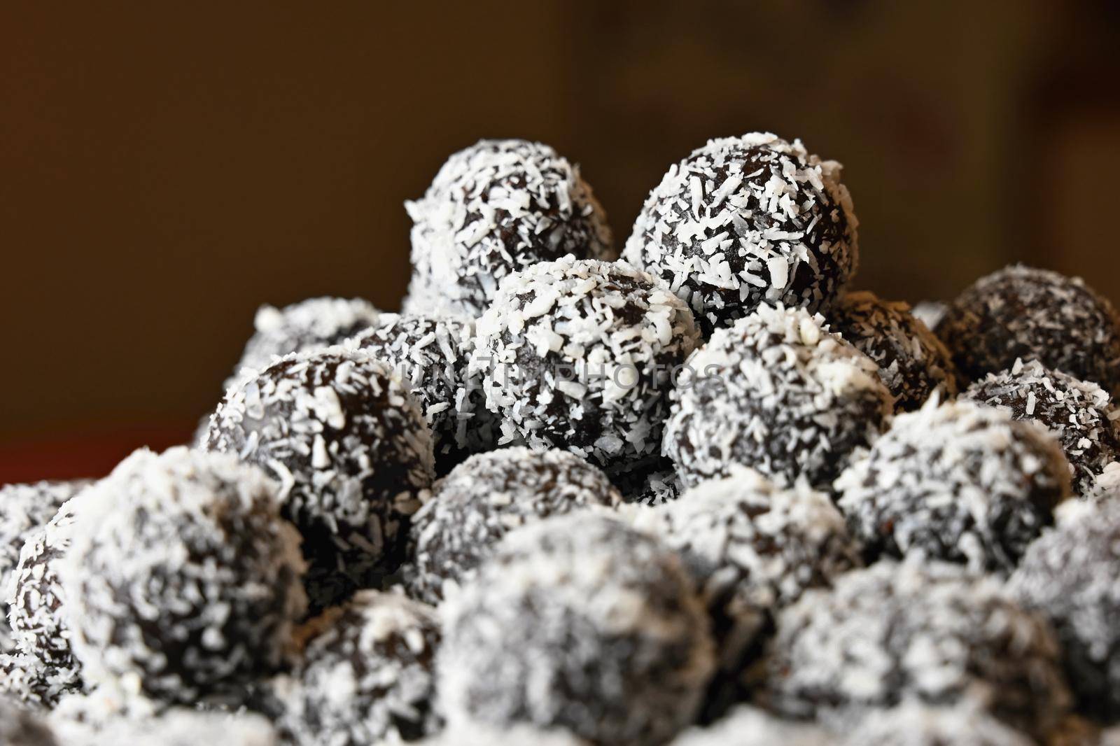 Rum balls. Traditional Czech Christmas cookies. Cocoa coated in coconut. by Montypeter