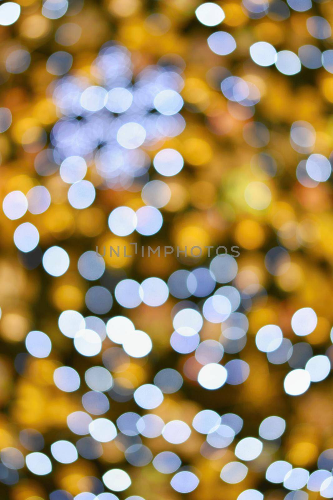 Christmas lights. Abstract colorful background with Christmas decoration. Bokeh - defocused.  by Montypeter