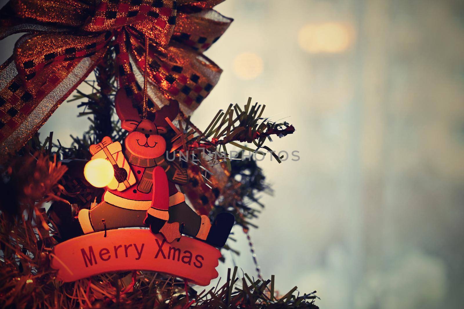 Christmas. Beautiful Christmas ornament on the Christmas tree. Seasonal background for winter holidays.