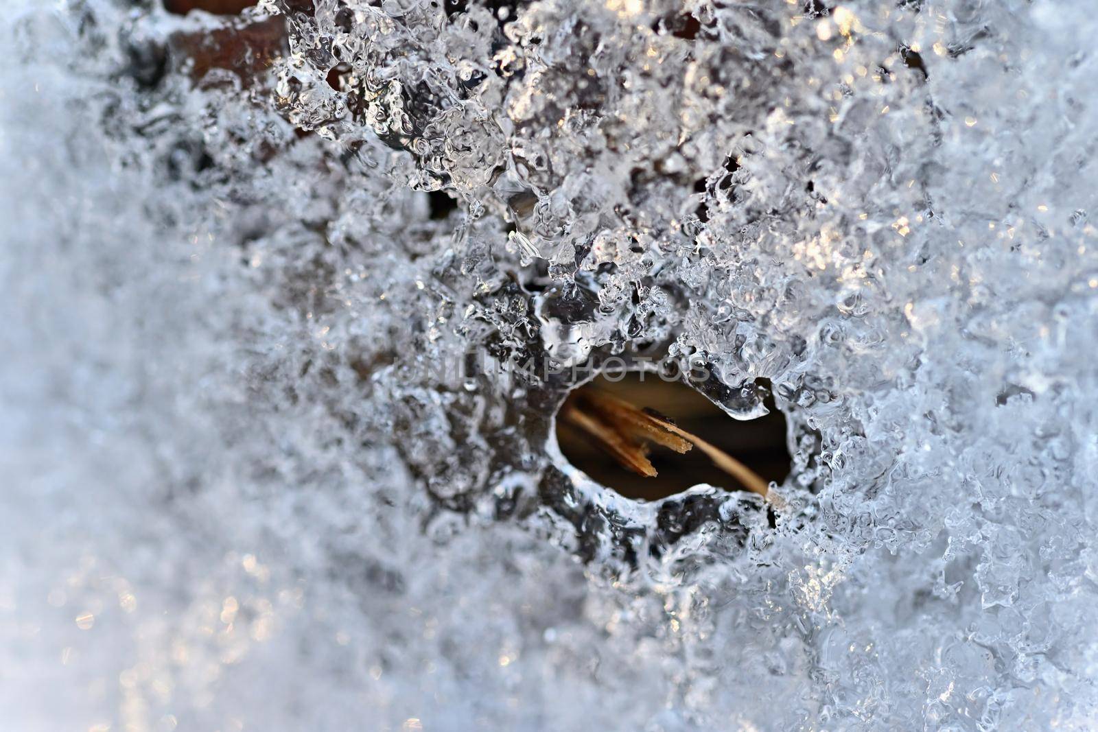 Macro shot of ice on a creek. Natural winter background.