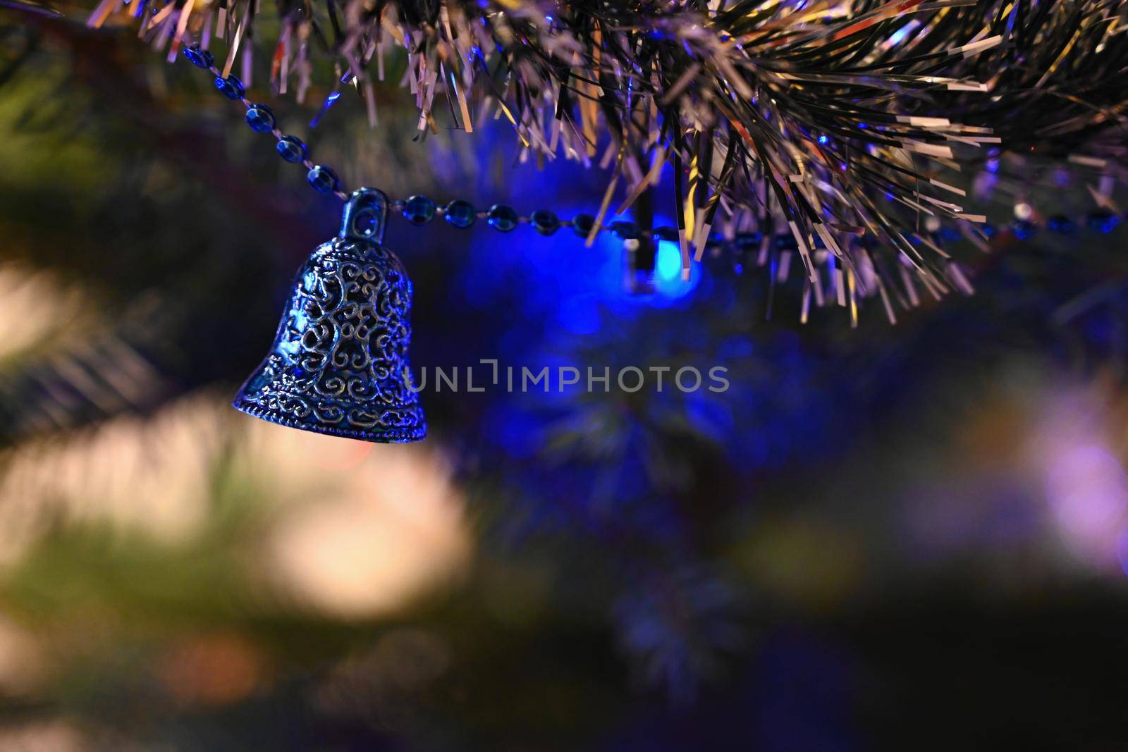 Christmas. Beautiful Christmas ornament on the Christmas tree. Seasonal background for winter holidays.