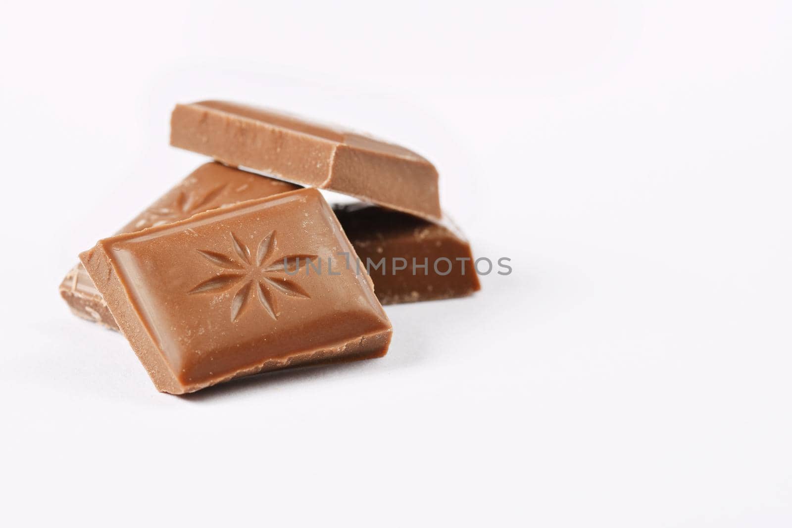 Close up a chocolate bar isolated on white background. by Montypeter