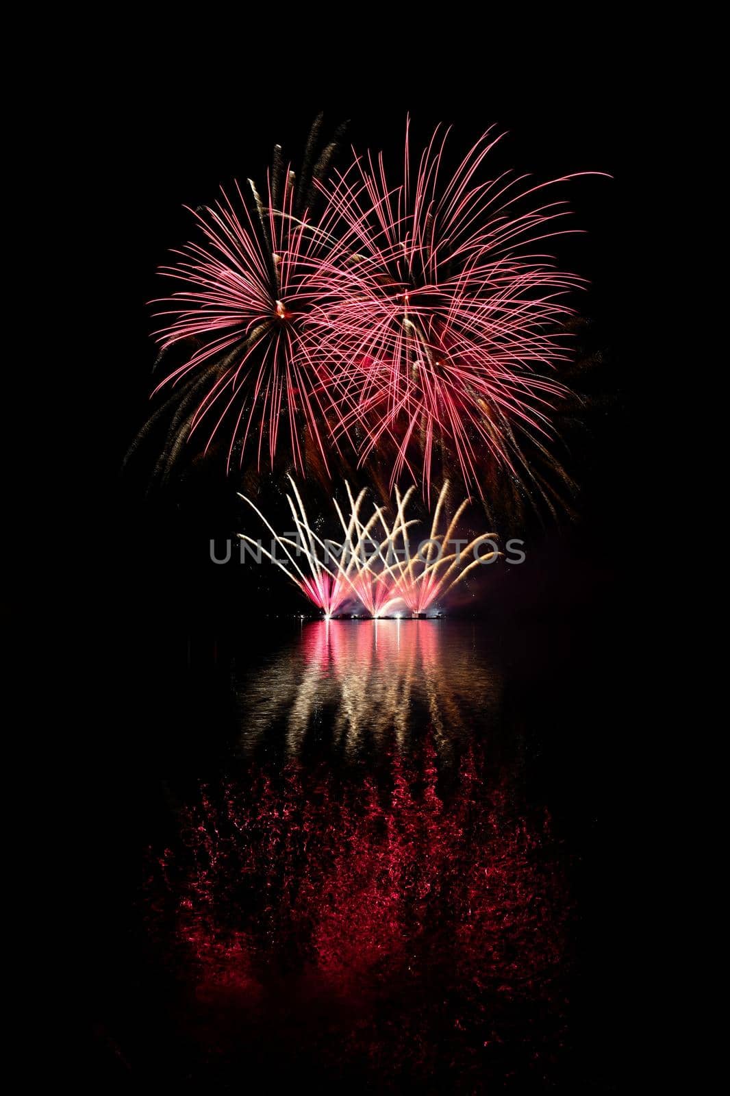 Beautiful colorful fireworks with reflections in water. Brno dam, the city of Brno-Europe. International Fireworks Competition. by Montypeter