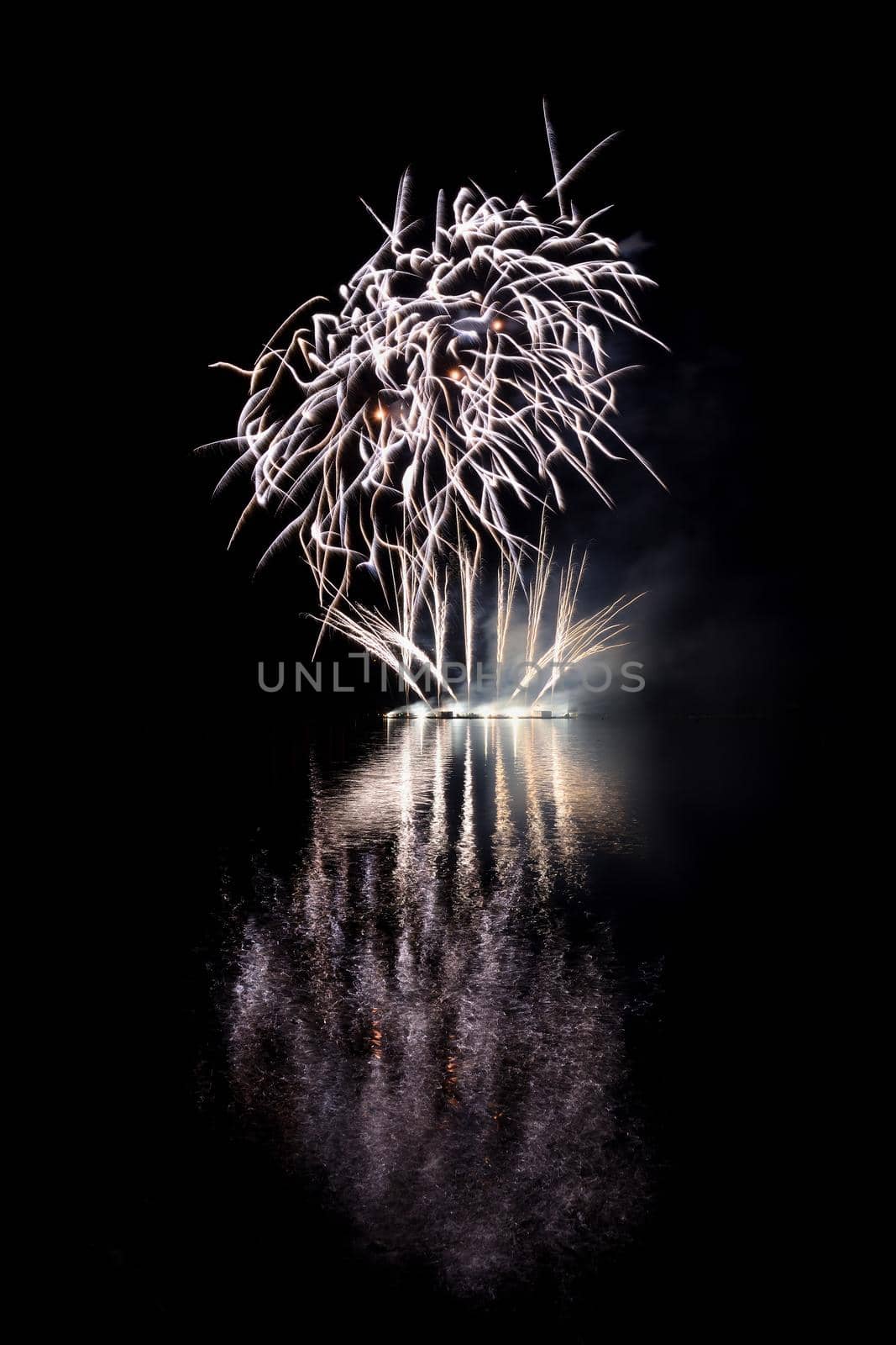 Beautiful colorful fireworks with reflections in water. Brno dam, the city of Brno-Europe. International Fireworks Competition.