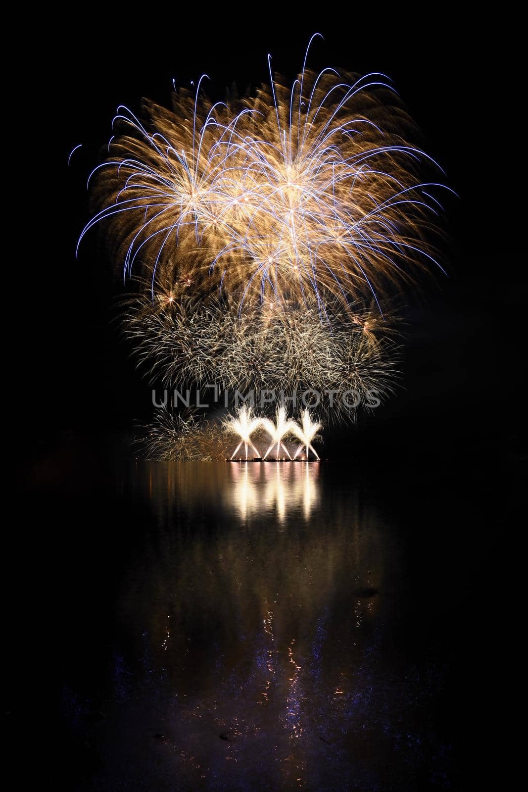 Beautiful colorful fireworks with reflections in water. Brno dam, the city of Brno-Europe. International Fireworks Competition. by Montypeter