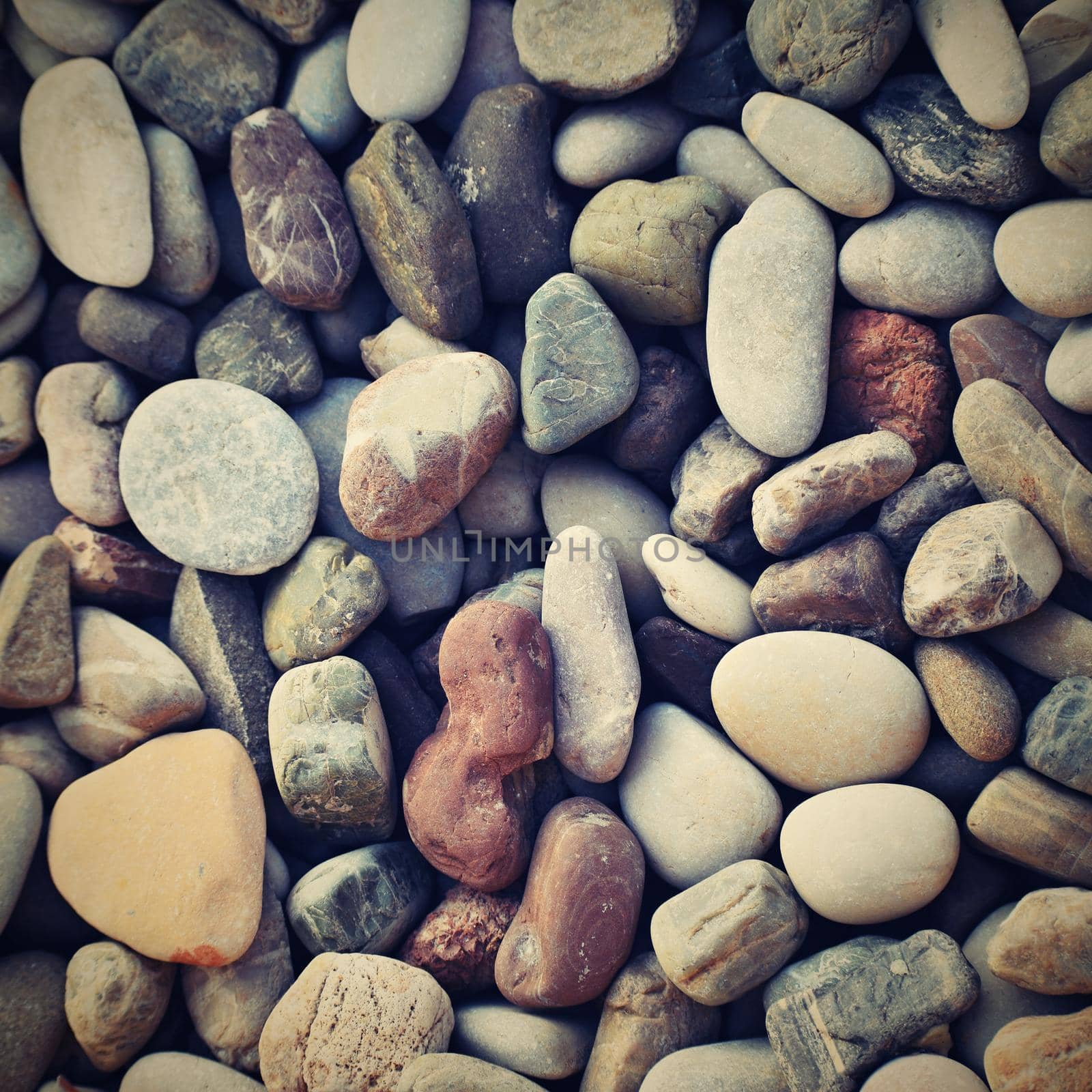 Beautiful colorful stones by the sea on the beach.