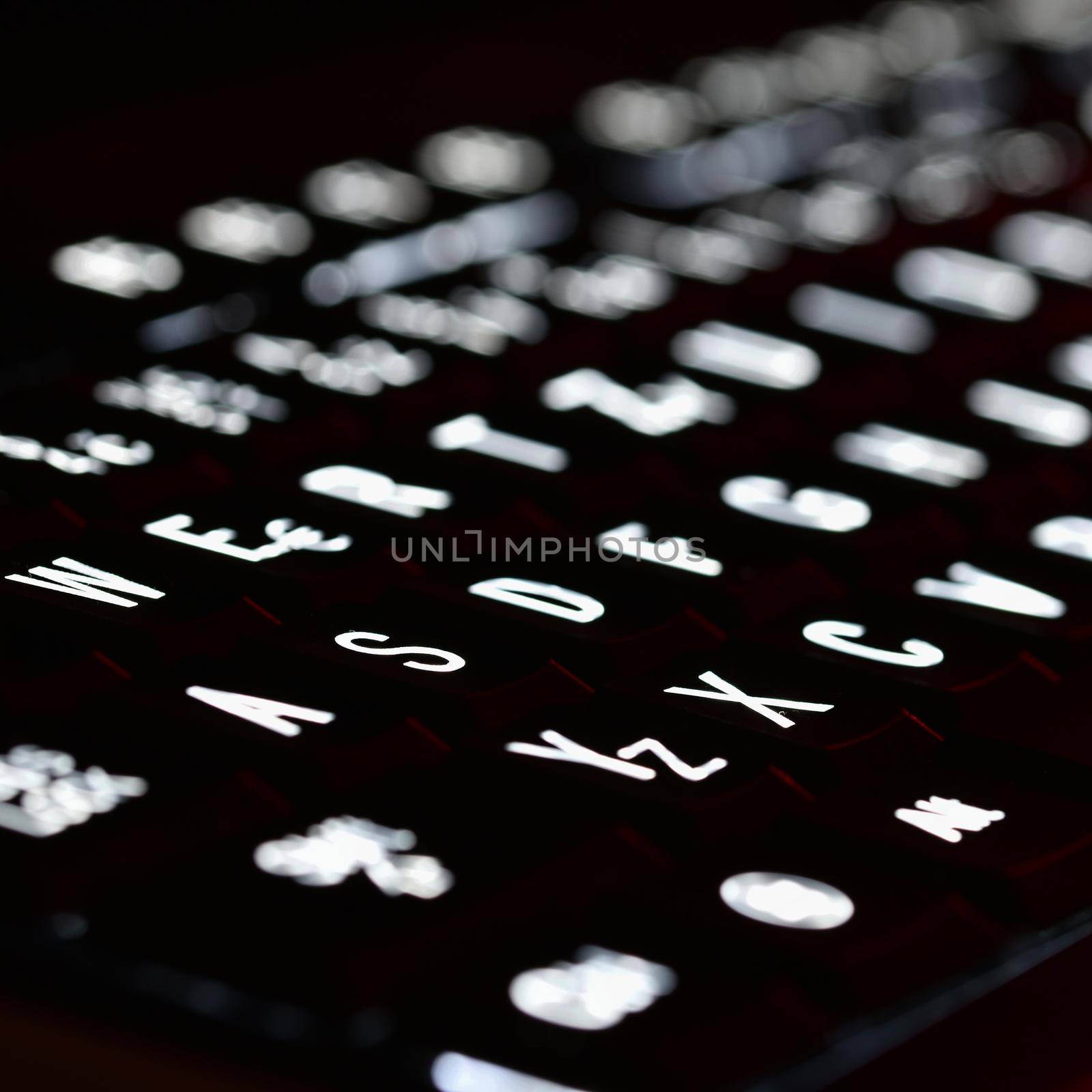 Closeup of laptop keyboard illumination. Concept for Computing and Modern Technology. Computer, network, internet.