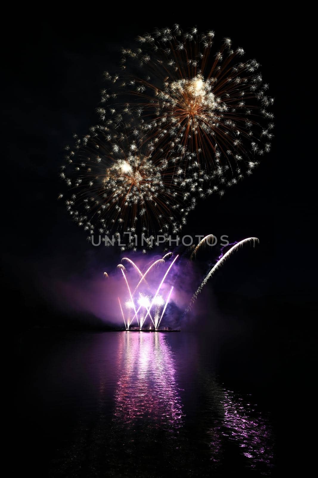 International competition of fireworks over the water surface. Brno Dam-Czech Republic-Brno. Beautiful colorful abstract fireworks. Concept for celebrations and holidays.