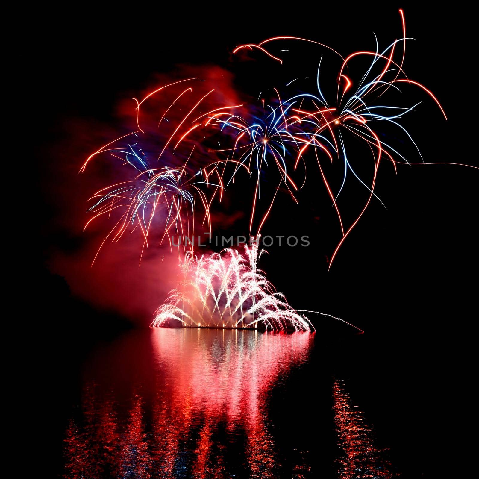 International competition of fireworks over the water surface. Brno Dam-Czech Republic-Brno. Beautiful colorful abstract fireworks. Concept for celebrations and holidays. by Montypeter