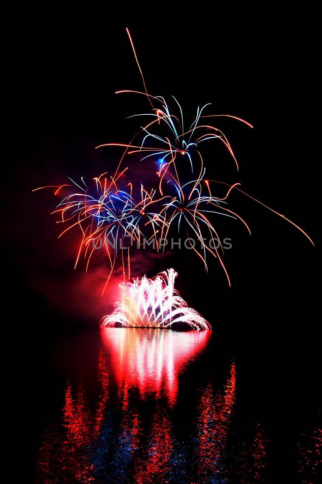 International competition of fireworks over the water surface. Brno Dam-Czech Republic-Brno. Beautiful colorful abstract fireworks. Concept for celebrations and holidays.