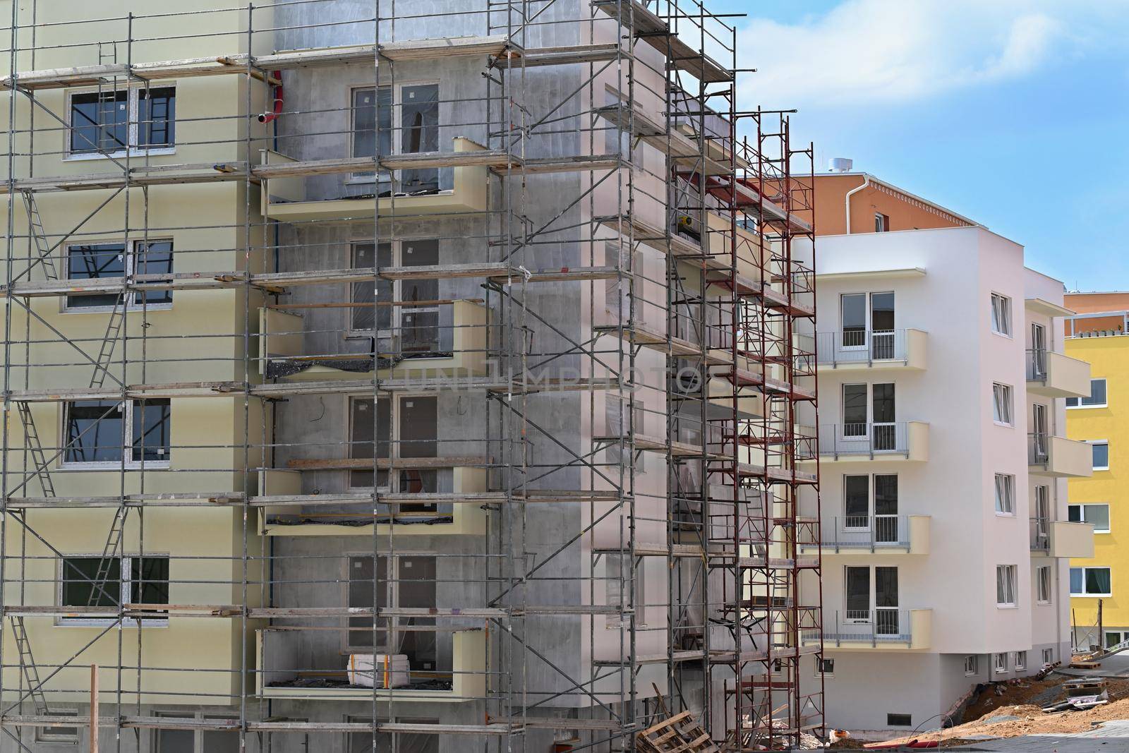 Crane and construction of new buildings. Beautiful background for the construction industry. 