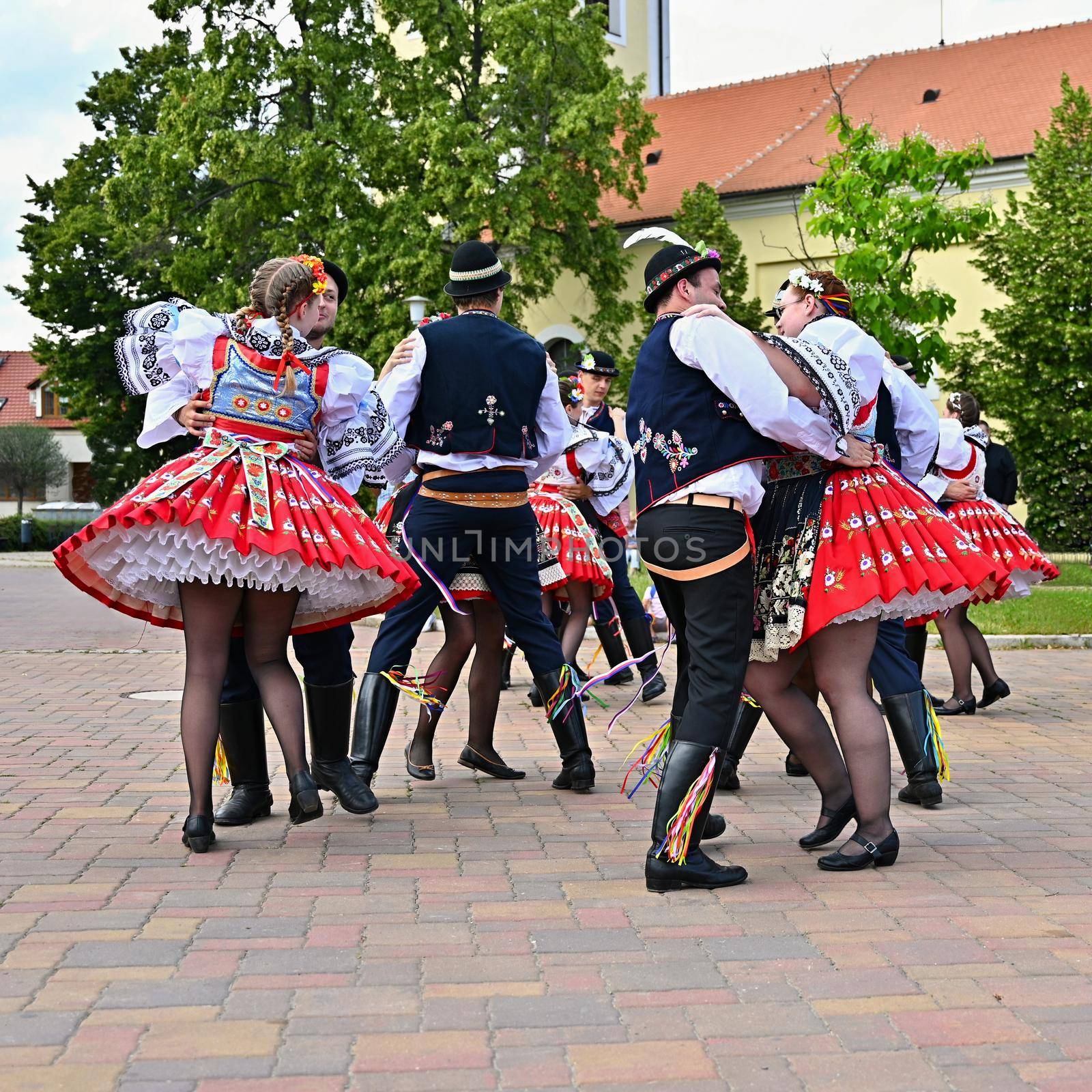 Brno - Bystrc, Czech Republic, June 22, 2019. Traditional Czech feast. Folk Festival. Girls and boys dancing in beautiful costumes. An old Christian holiday, a day of abundance, joy and prosperity. by Montypeter