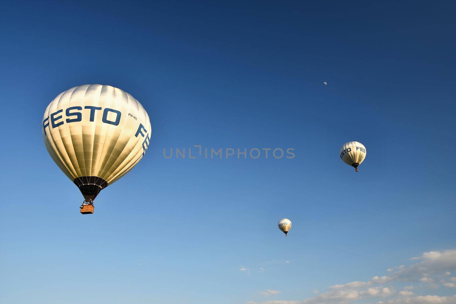 Colorful hot air balloon flying at sunset. Natural colorful background with sky.