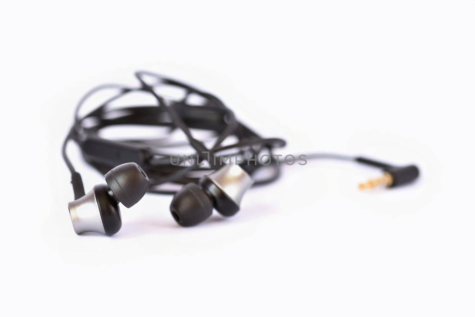 Headphones - small black balls. Isolated on a clean white background.