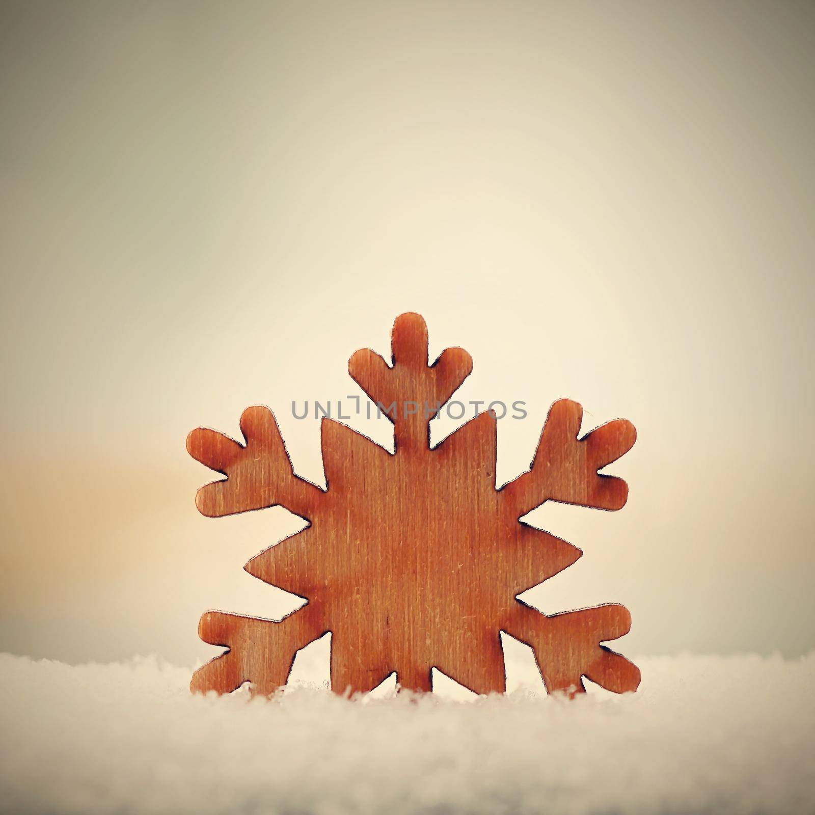 Christmas background. Christmas tree decoration - beautiful natural wooden snowflake with real snow. Background for winter and holiday.  by Montypeter