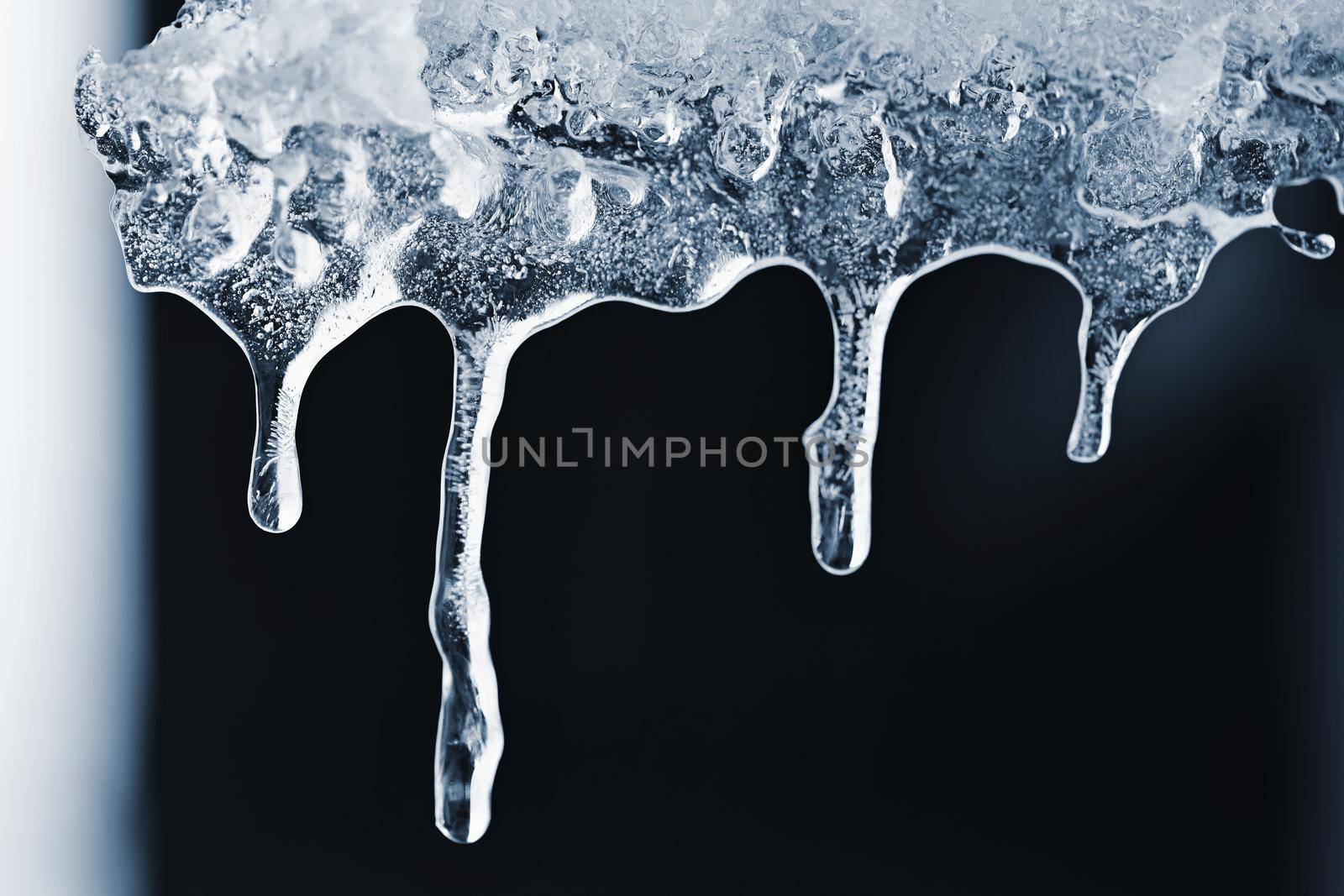 Beautiful icicles in winter. Concept for winter and frost.