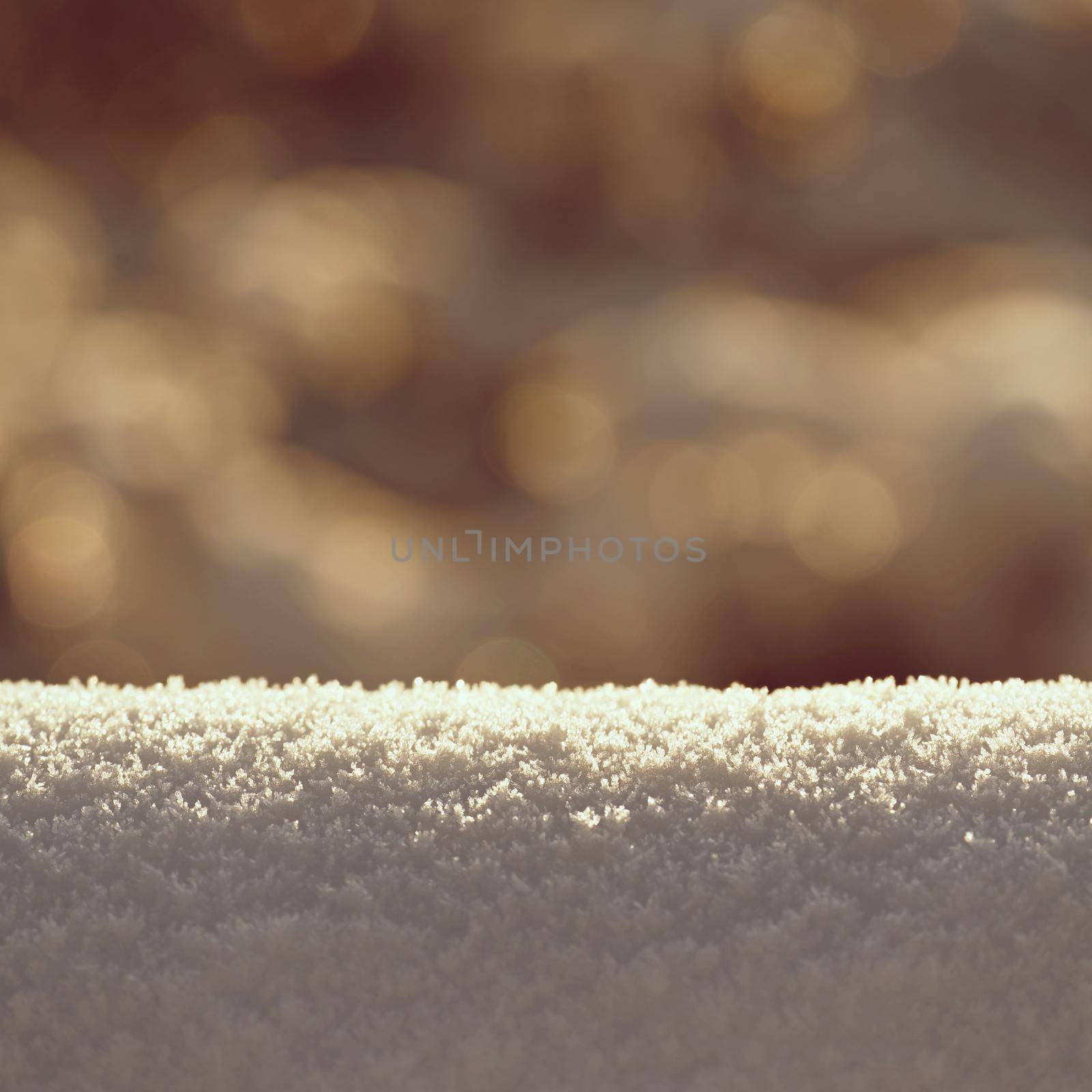 Beautiful clean winter background with real snow.
Sun and outdoor nature bokeh.