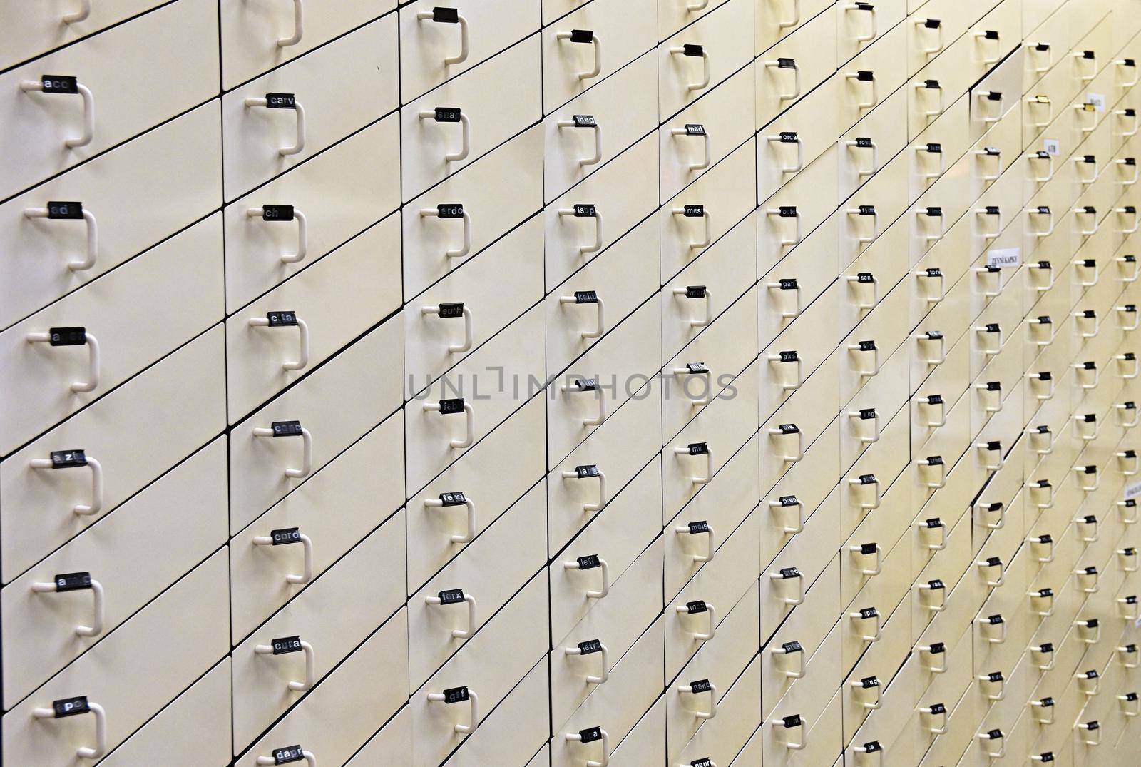 Background with wooden white drawers.