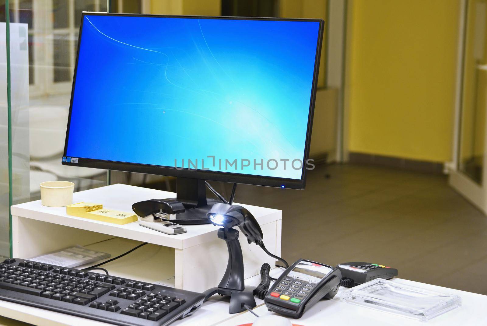 Empty cash desk with terminal in supermarket. Concept for business and sales.