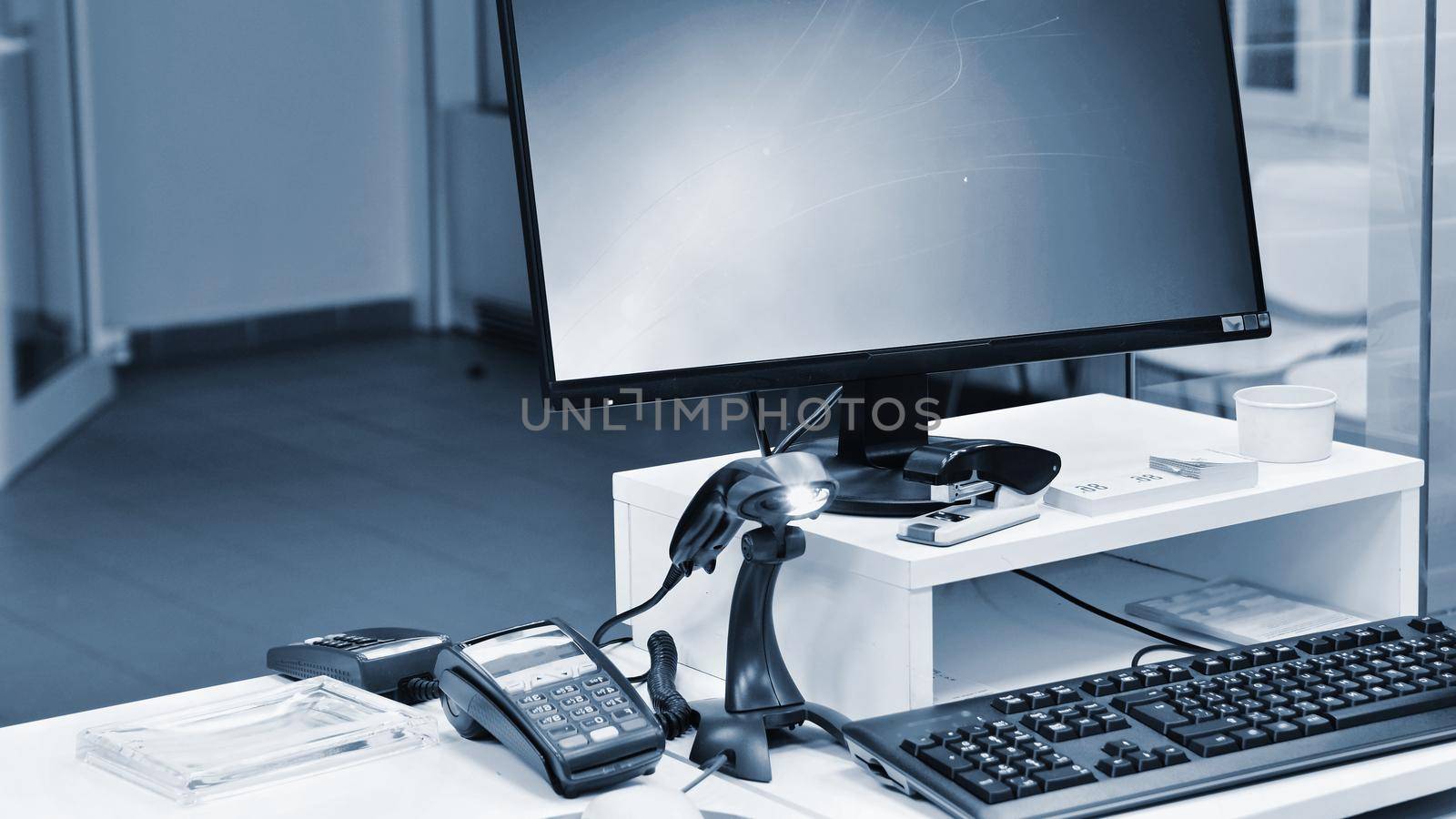 Empty cash desk with terminal in supermarket. Concept for business and sales.