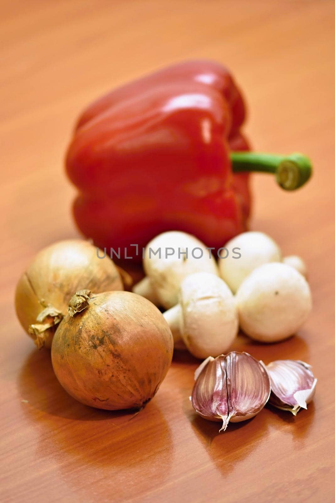 Vegetables on a wooden table. by Montypeter