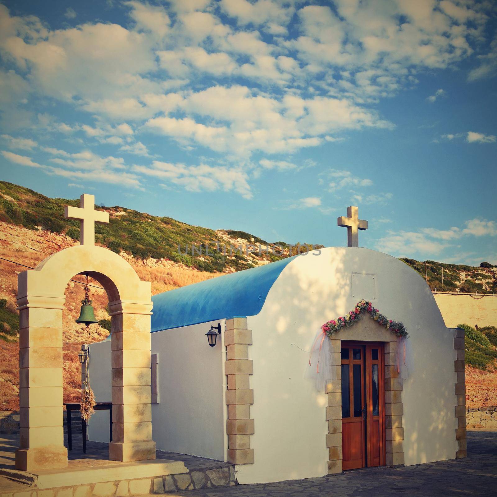 Beautiful little Greek chapel at sunset on the island of Crete - Greece.
