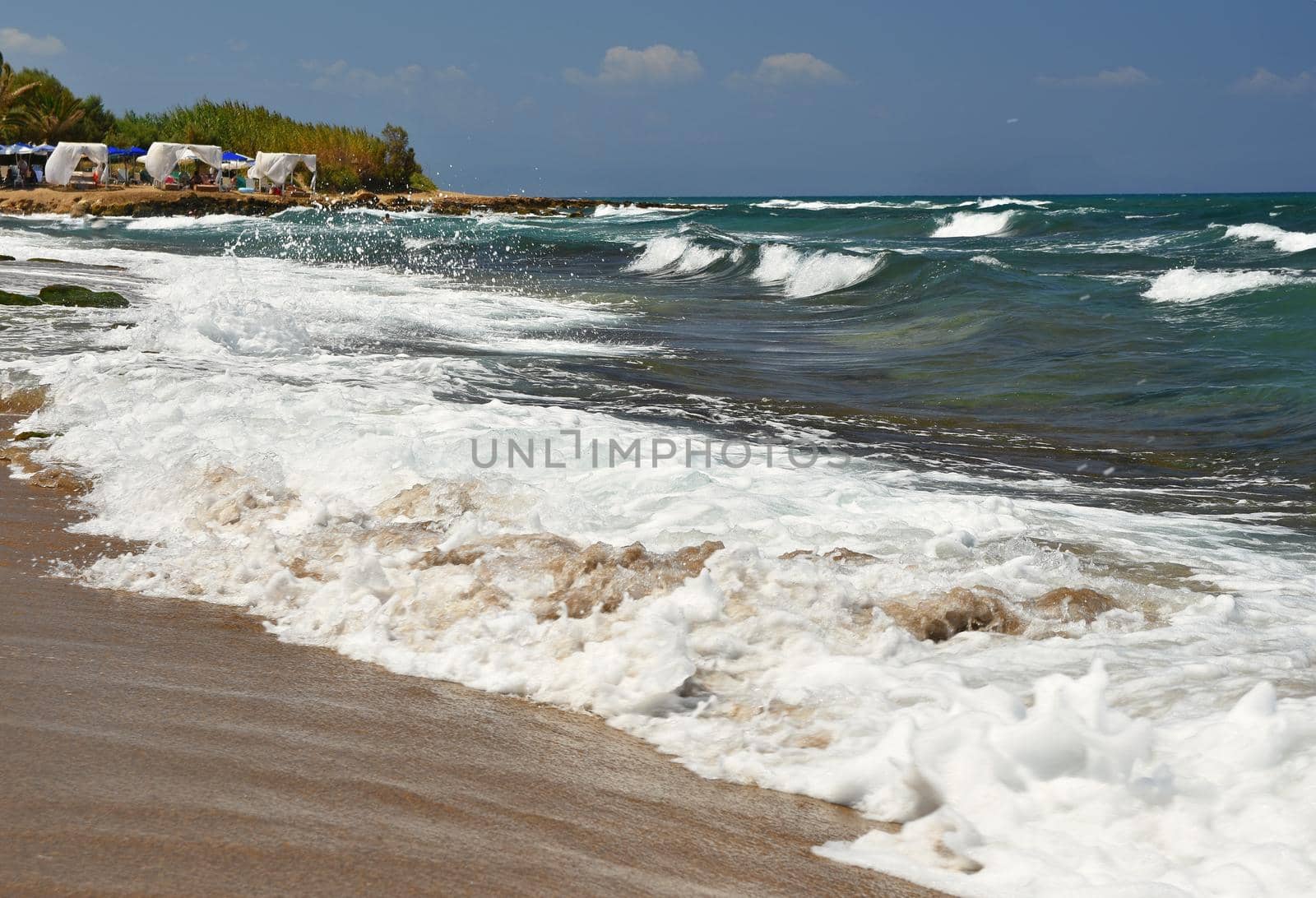 Beautiful clean sea and waves. Summer background for travel and holidays. Greece Crete.. Amazing scenery on the beach. 