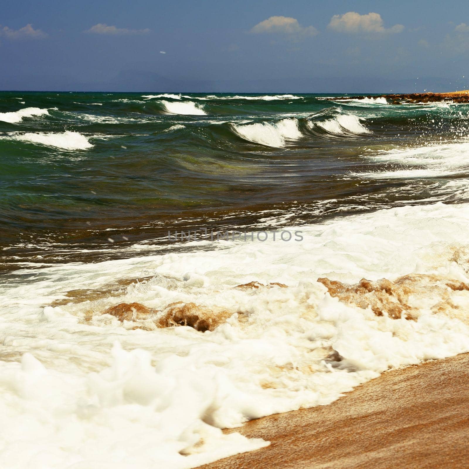 Beautiful clean sea and waves. Summer background for travel and holidays. Greece Crete.. Amazing scenery on the beach. 