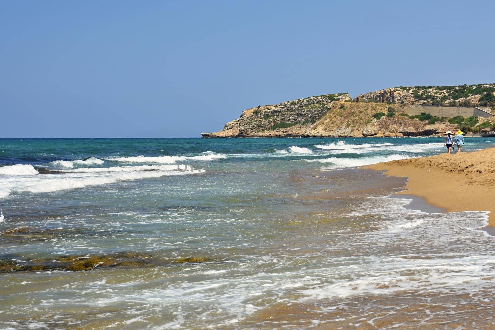 Beautiful clean sea and waves. Summer background for travel and holidays. Greece Crete.. Amazing scenery on the beach. 