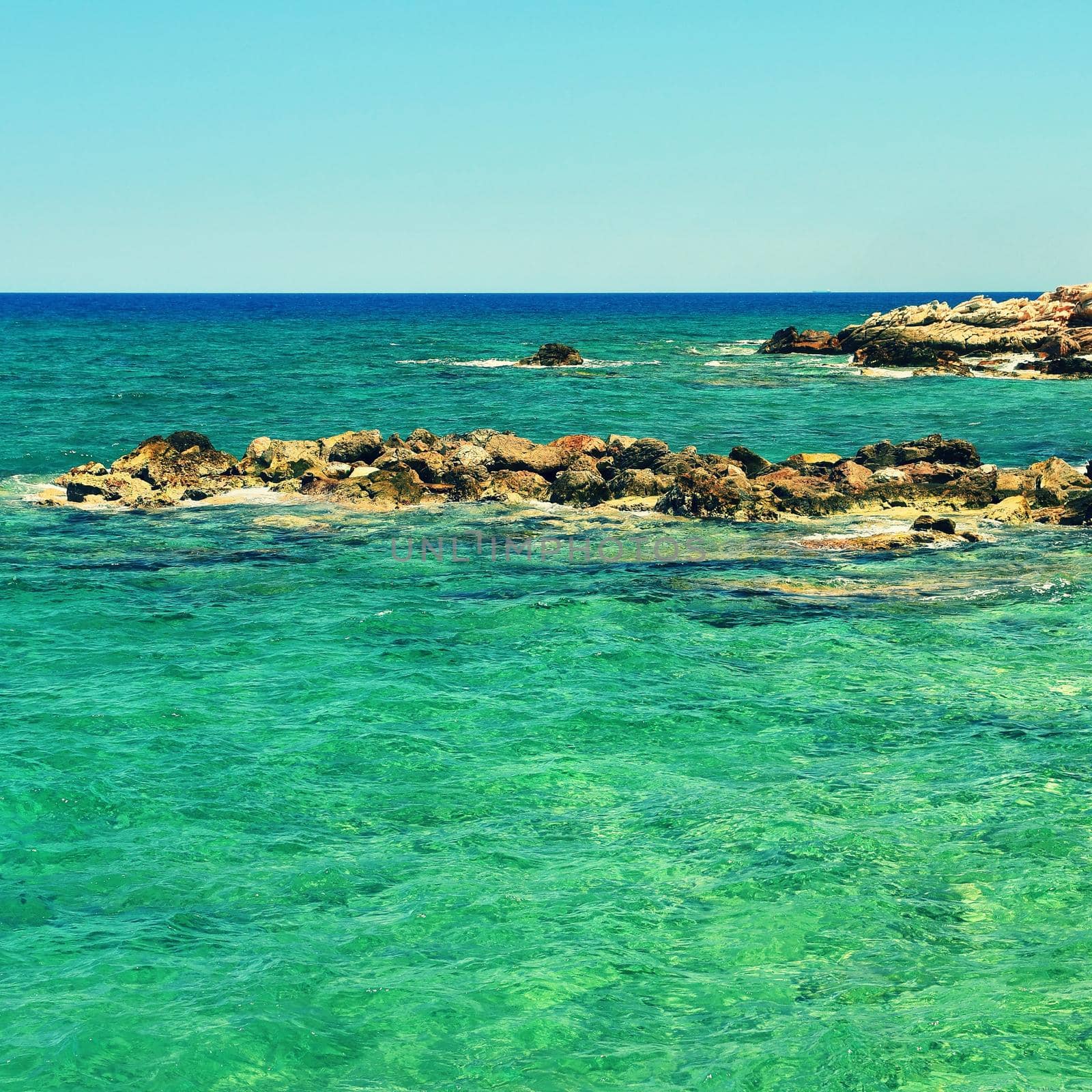 Beautiful clean sea and waves. Summer background for travel and holidays. Greece Crete.. Amazing scenery on the beach. 