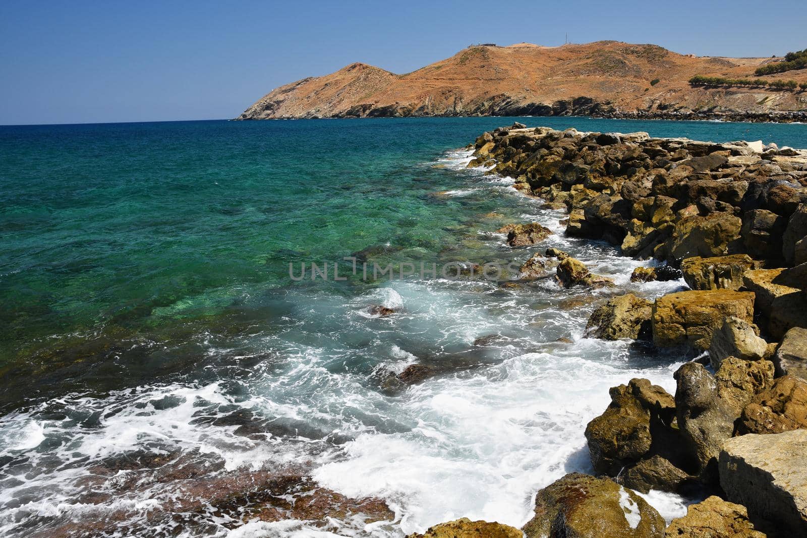 Beautiful clean sea and waves. Summer background for travel and holidays. Greece Crete.. Amazing scenery on the beach. 
