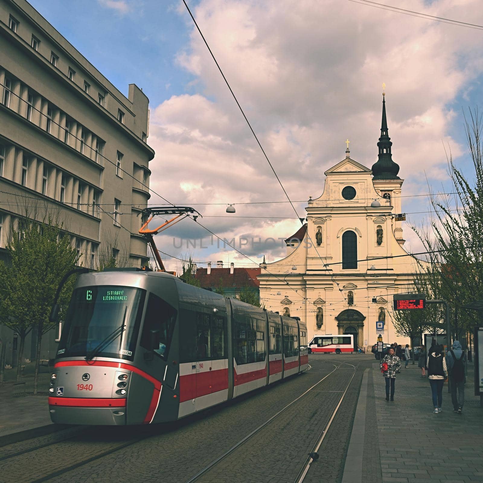 April 16, 2017, the city of Brno. - Czech Republic - Europe. St. Thomas Church in the center and public transport - tram.