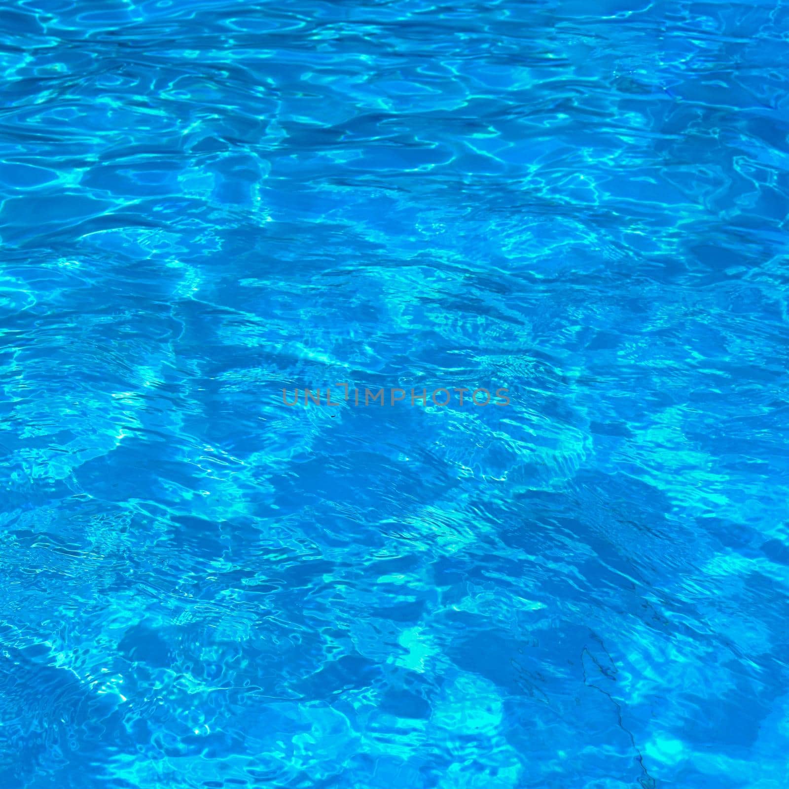 Pool with clean water. Summer background for traveling.