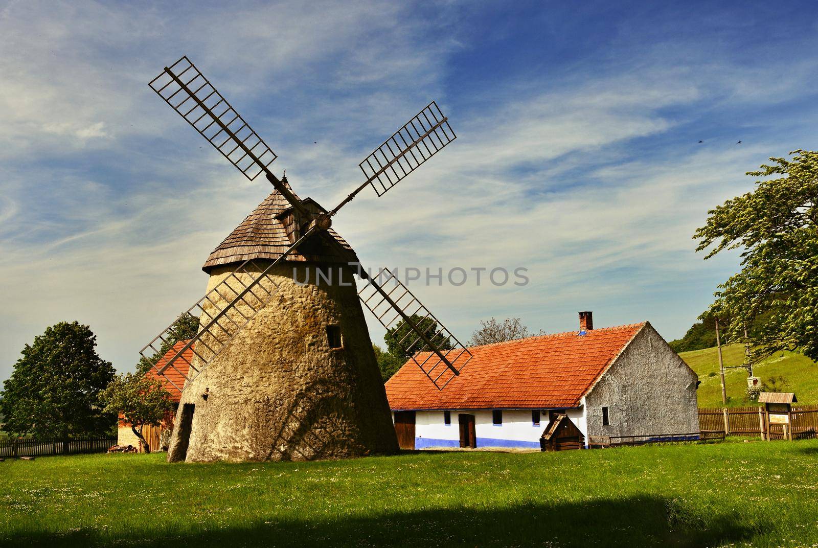 Old windmill - Czech Republic Europe. Beautiful old traditional mill house with a garden. Kuzelov - South Moravia.