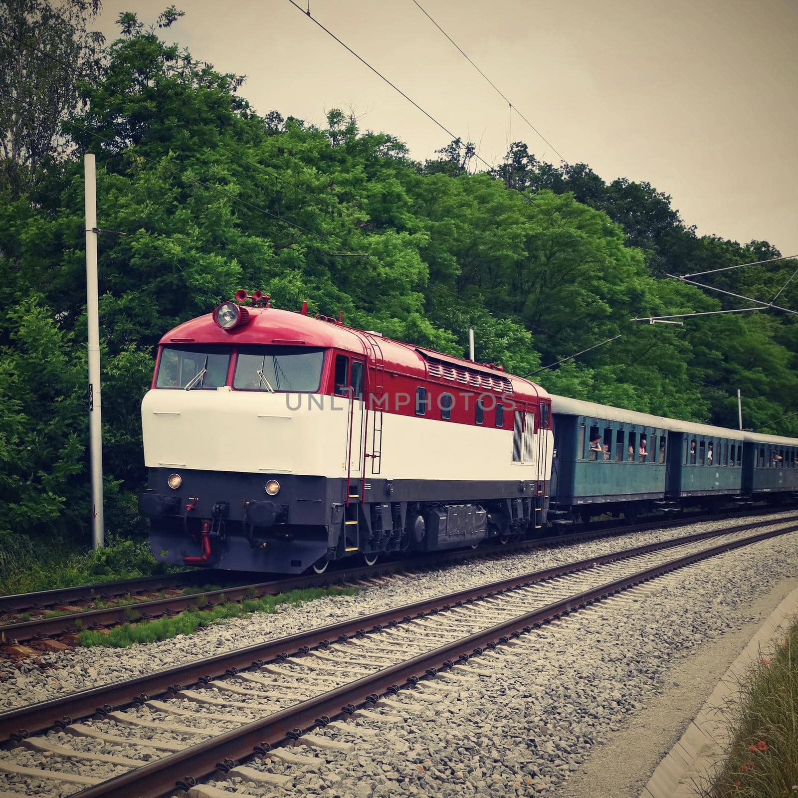 Beautiful Czech passenger train with carriages. by Montypeter