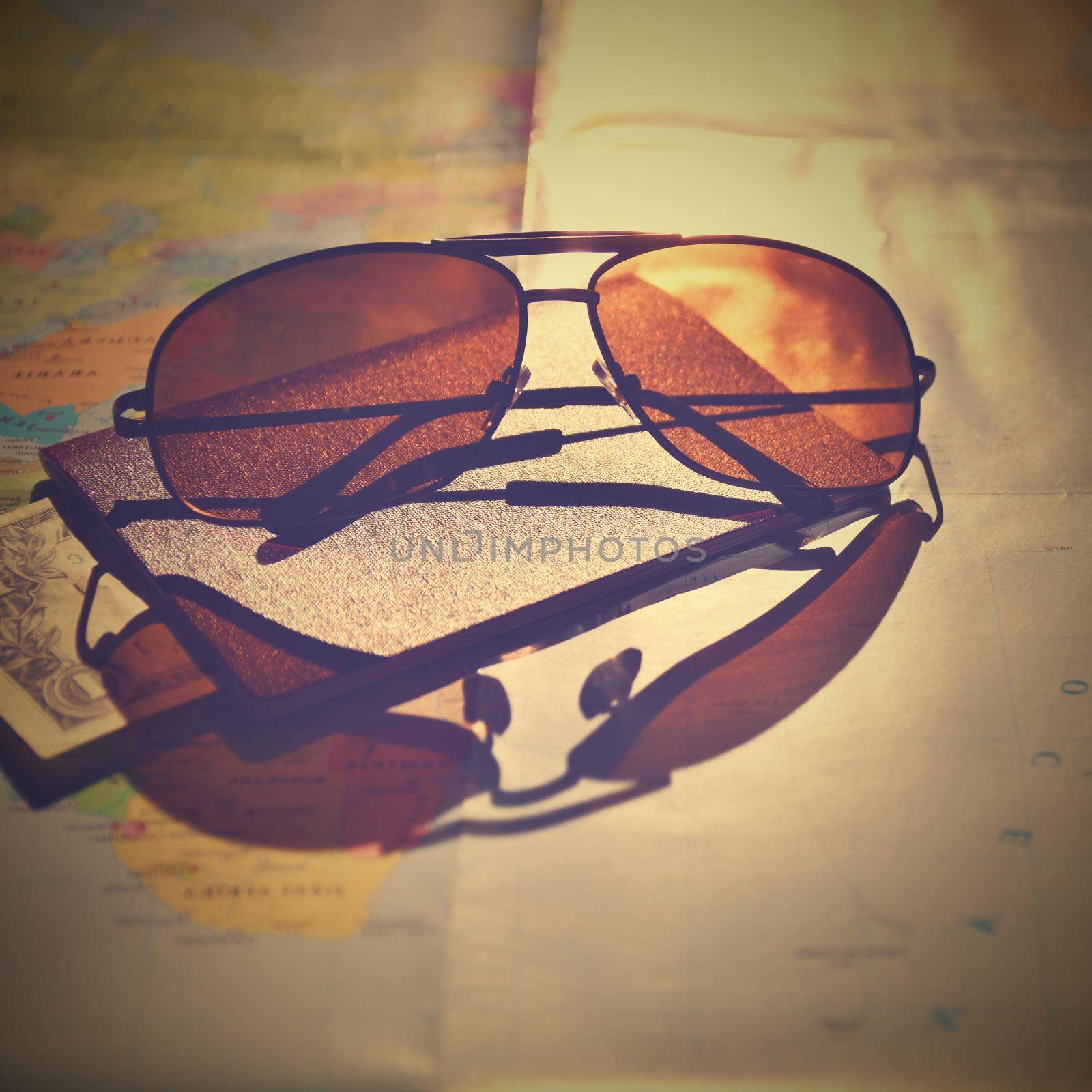 Beautiful concept for summer travel. Sunglasses with passport. Planning a summer vacation and holidays.