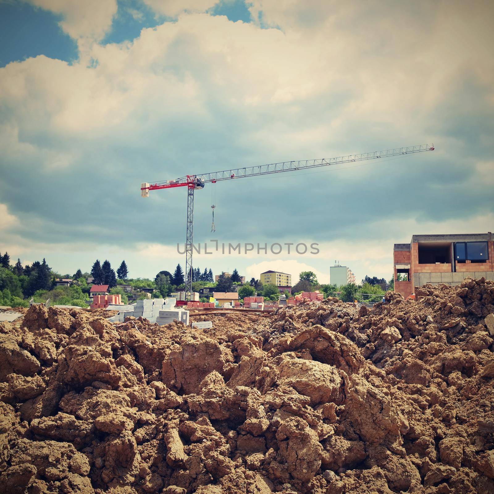 Crane and construction of new buildings. Beautiful background for the construction industry. 