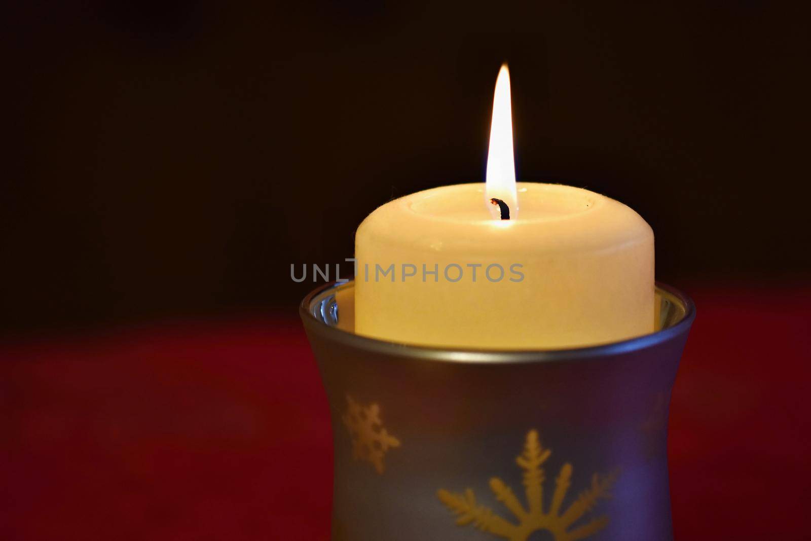 beautiful candle burning with a pure black background
