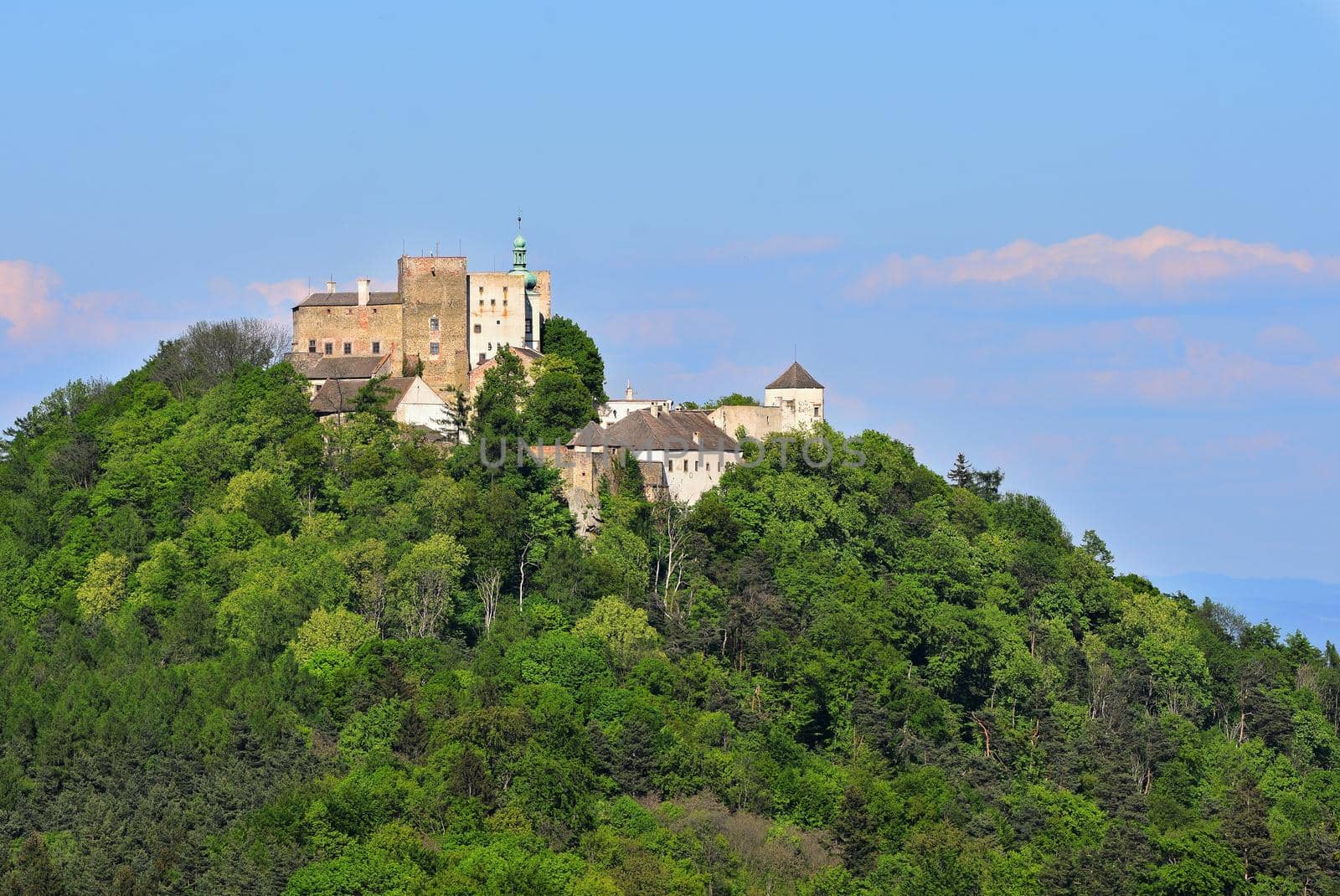Beautiful old castle Buchlov. South Moravia-Czech Republic-Europe.
Spring landscape with forests, castle and blue sky.