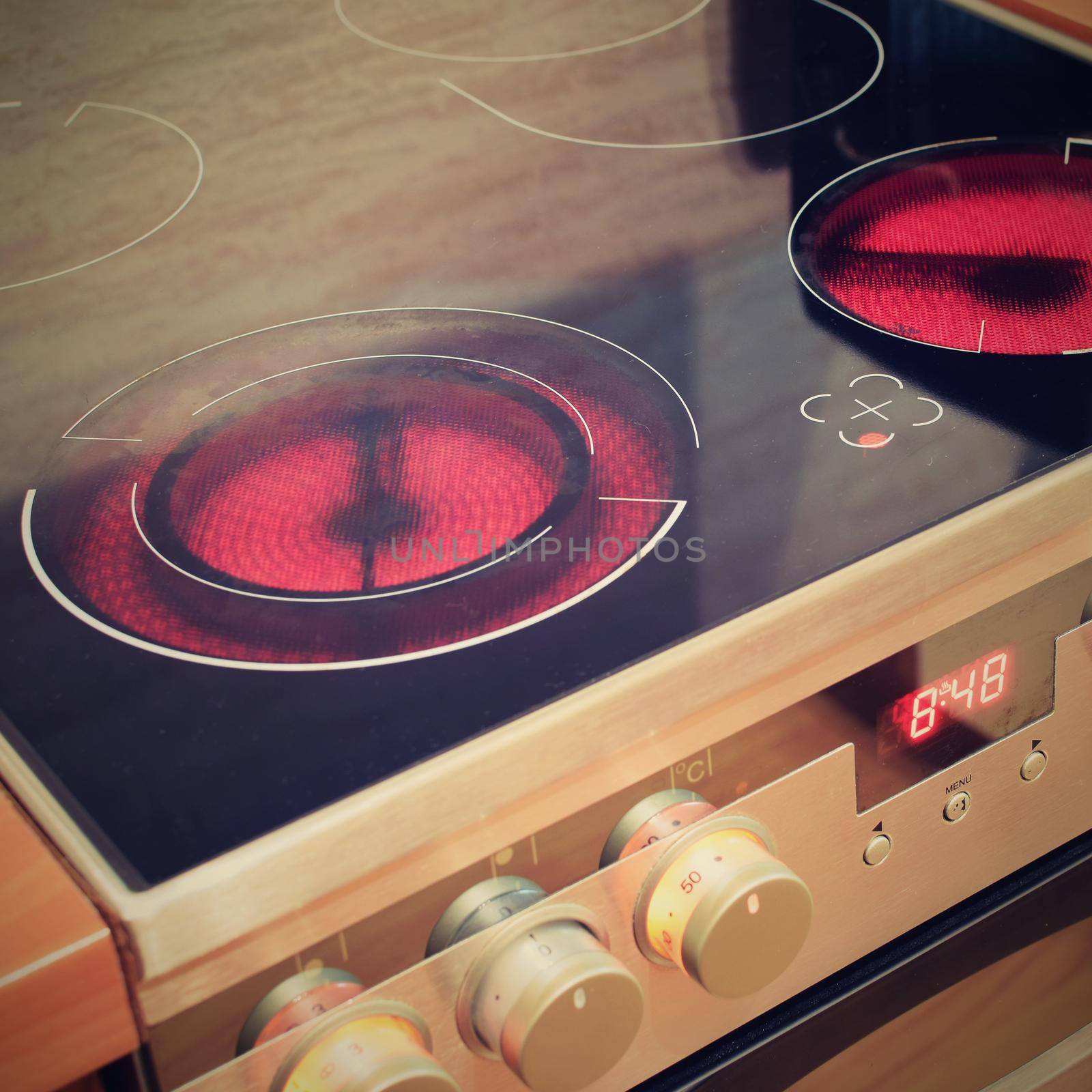 Electric ceramic stove inside the kitchen by Montypeter