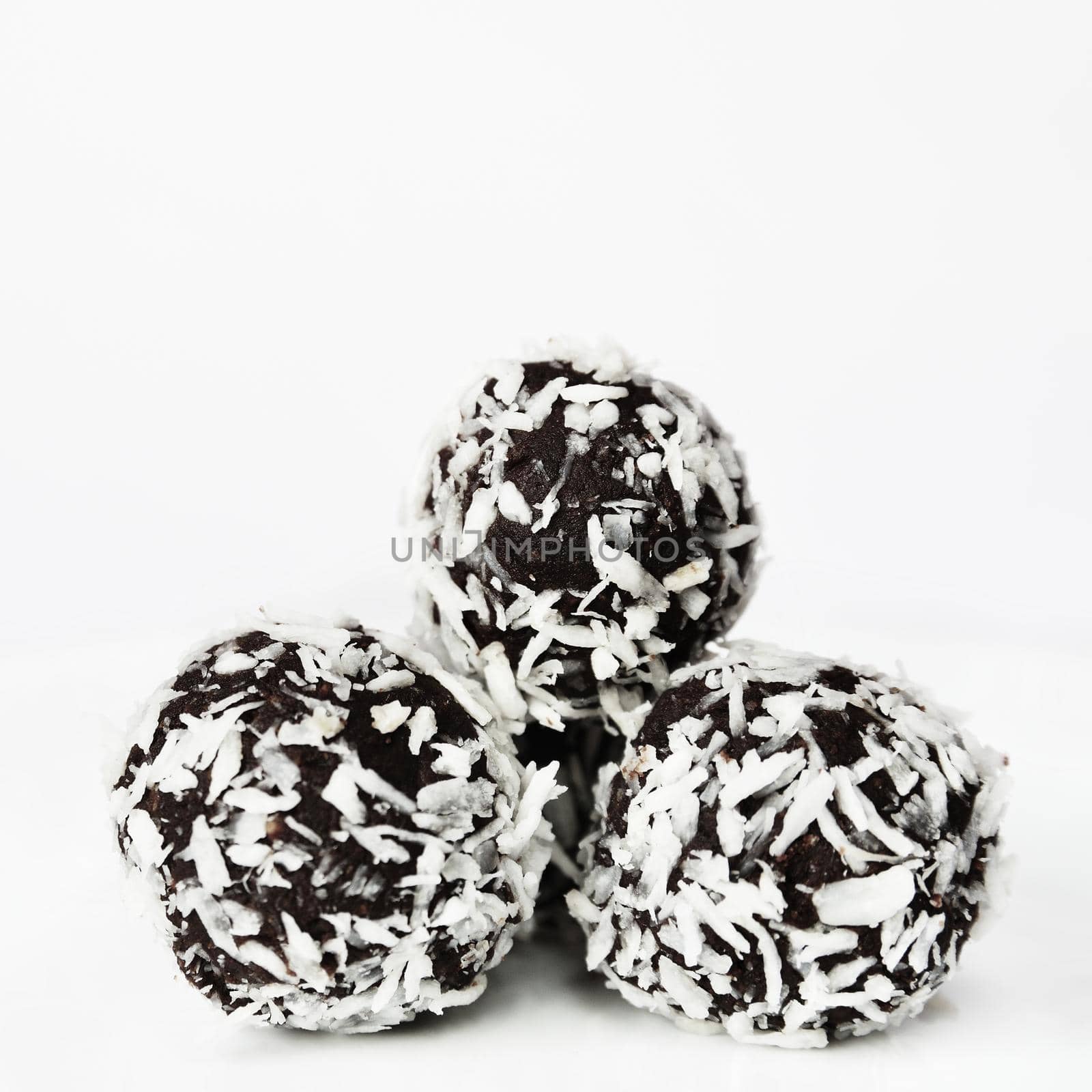 Christmas sweets on a plate - Rum balls in coconut. Traditional homemade handmade Czech sweets.