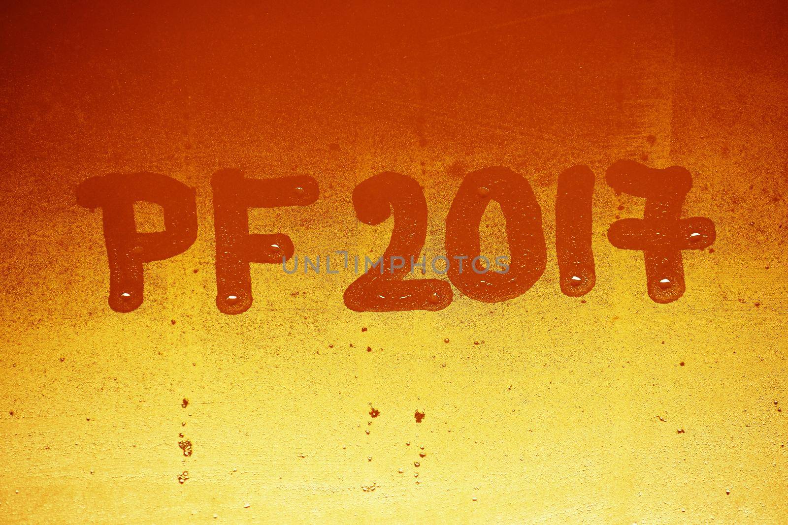 PF 2017 written on a misty window. Background for the celebration of the New Year 2017