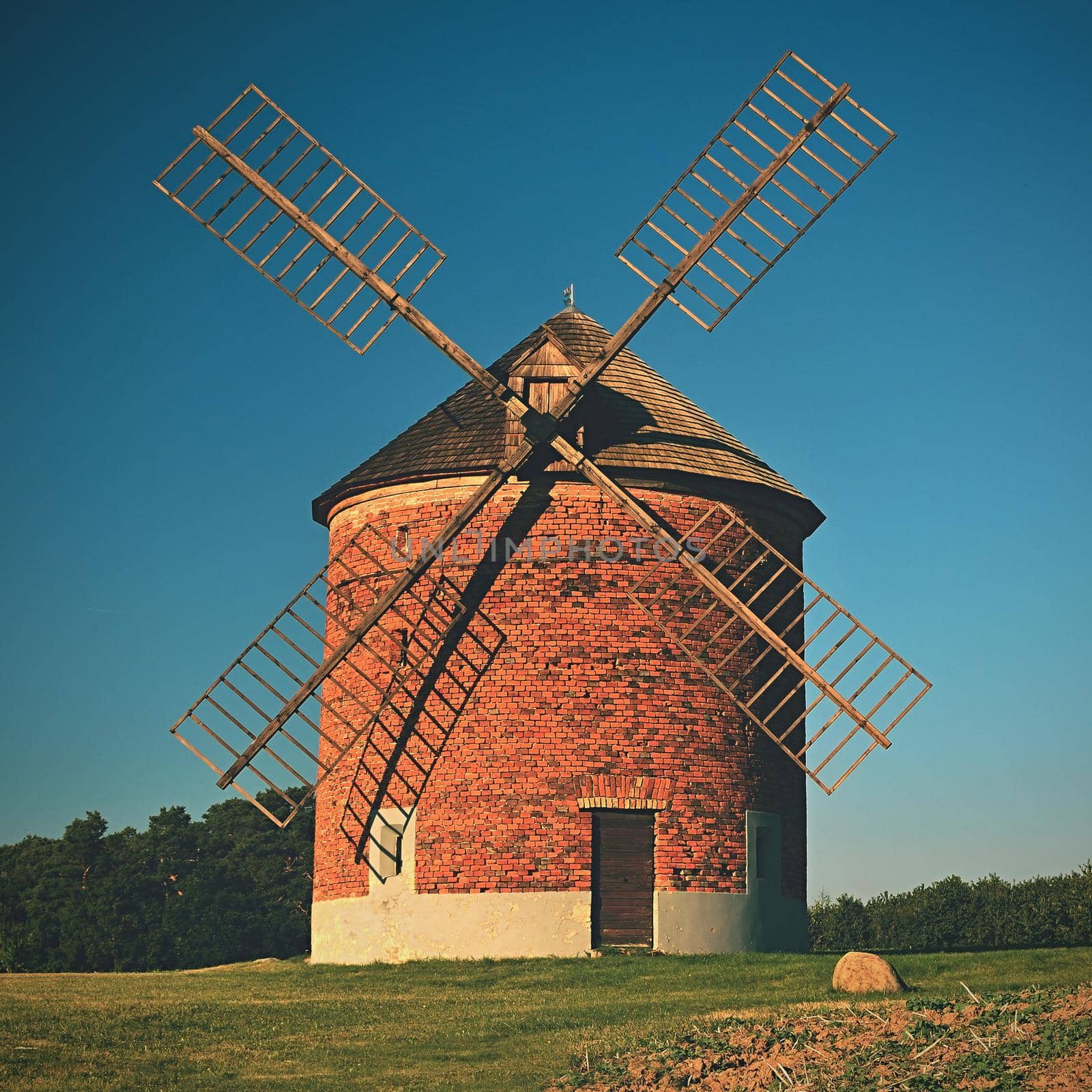 Beautiful old windmill and landscape with the sun. Chvalkovice - Czech Republic. Europe. by Montypeter