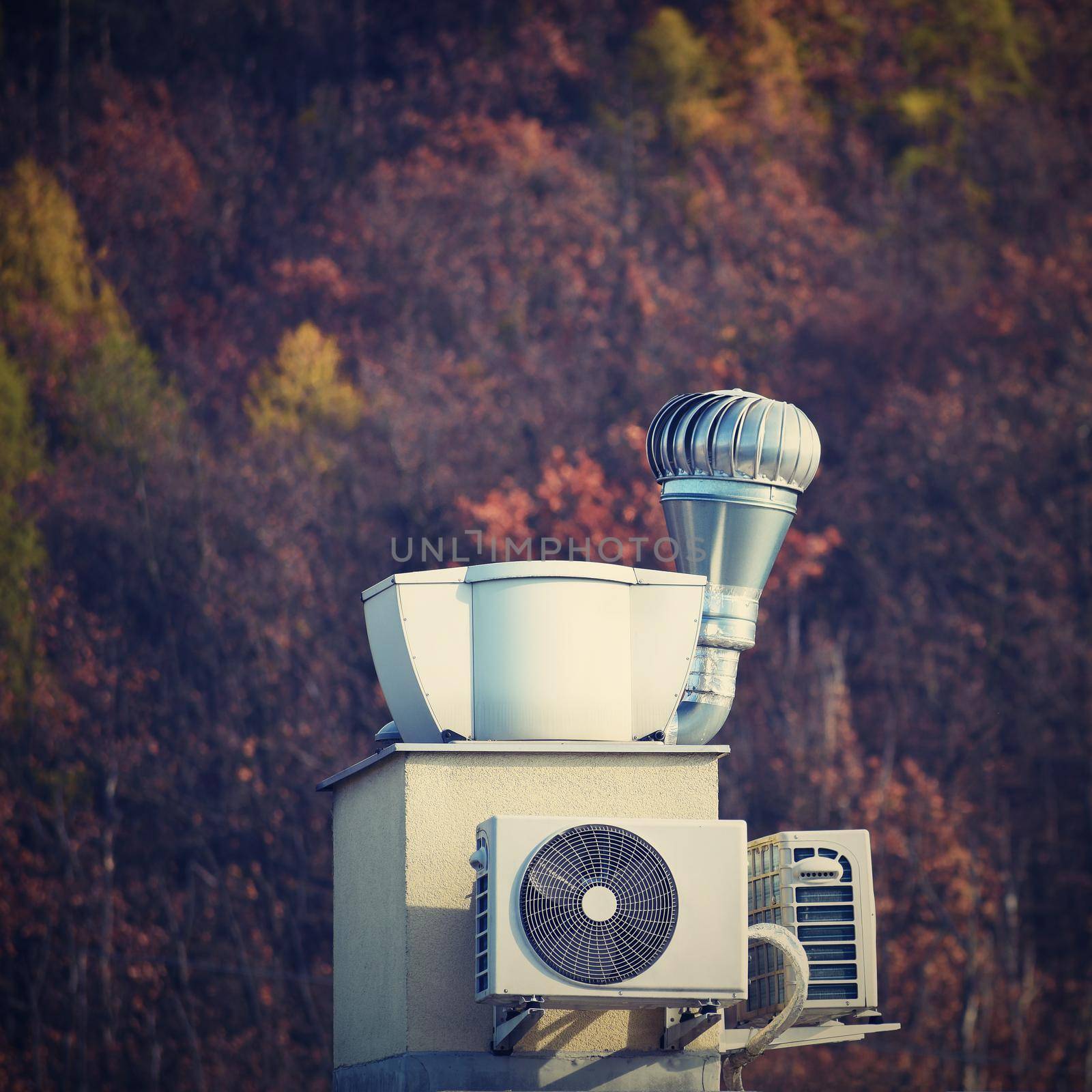 Ventilation and air conditioning on the roof of the house by Montypeter