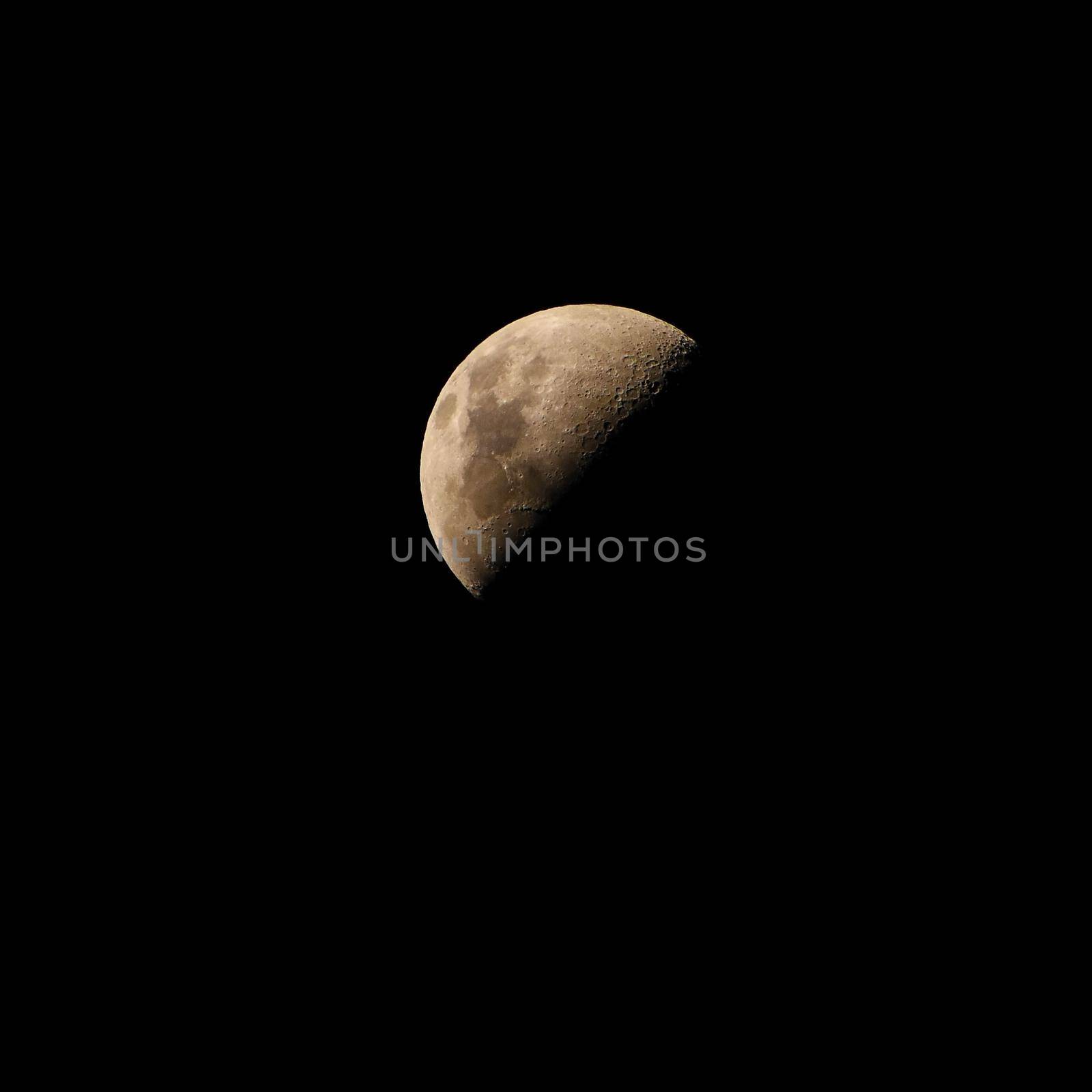 Moon over dark black sky at night by Montypeter