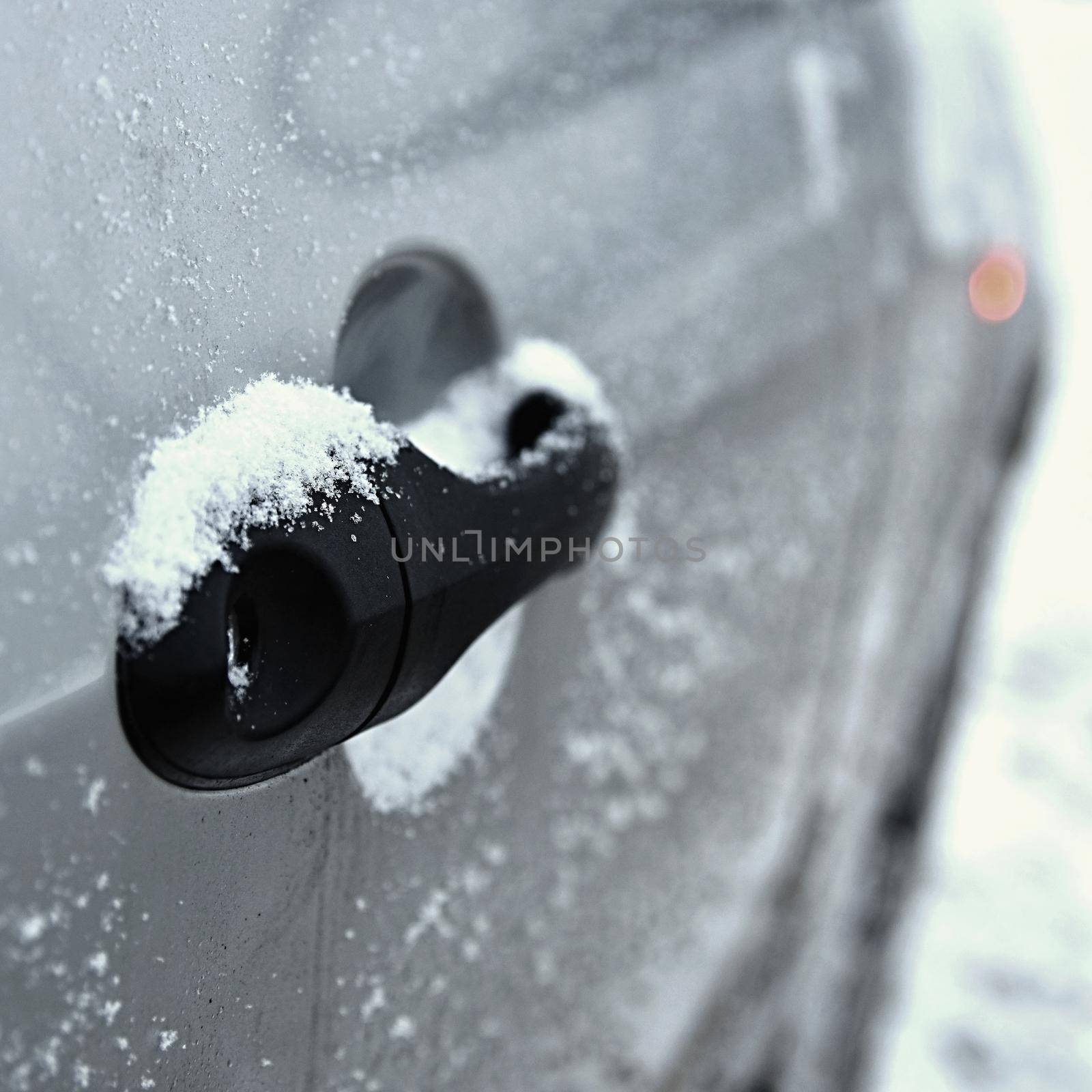 Winter car, the concept of winter car ride.Icing on the handle of the car.