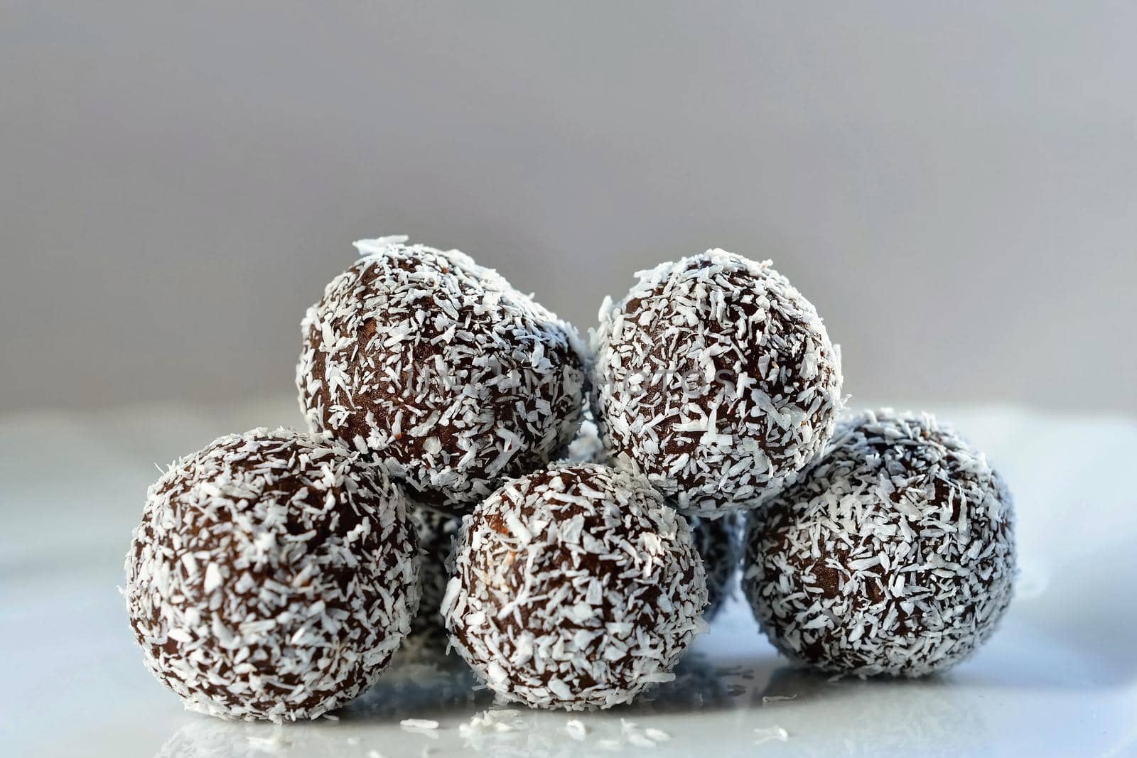 Homemade coconut rum balls on plate. Christmas sweets. Traditional homemade handmade Czech sweets. by Montypeter