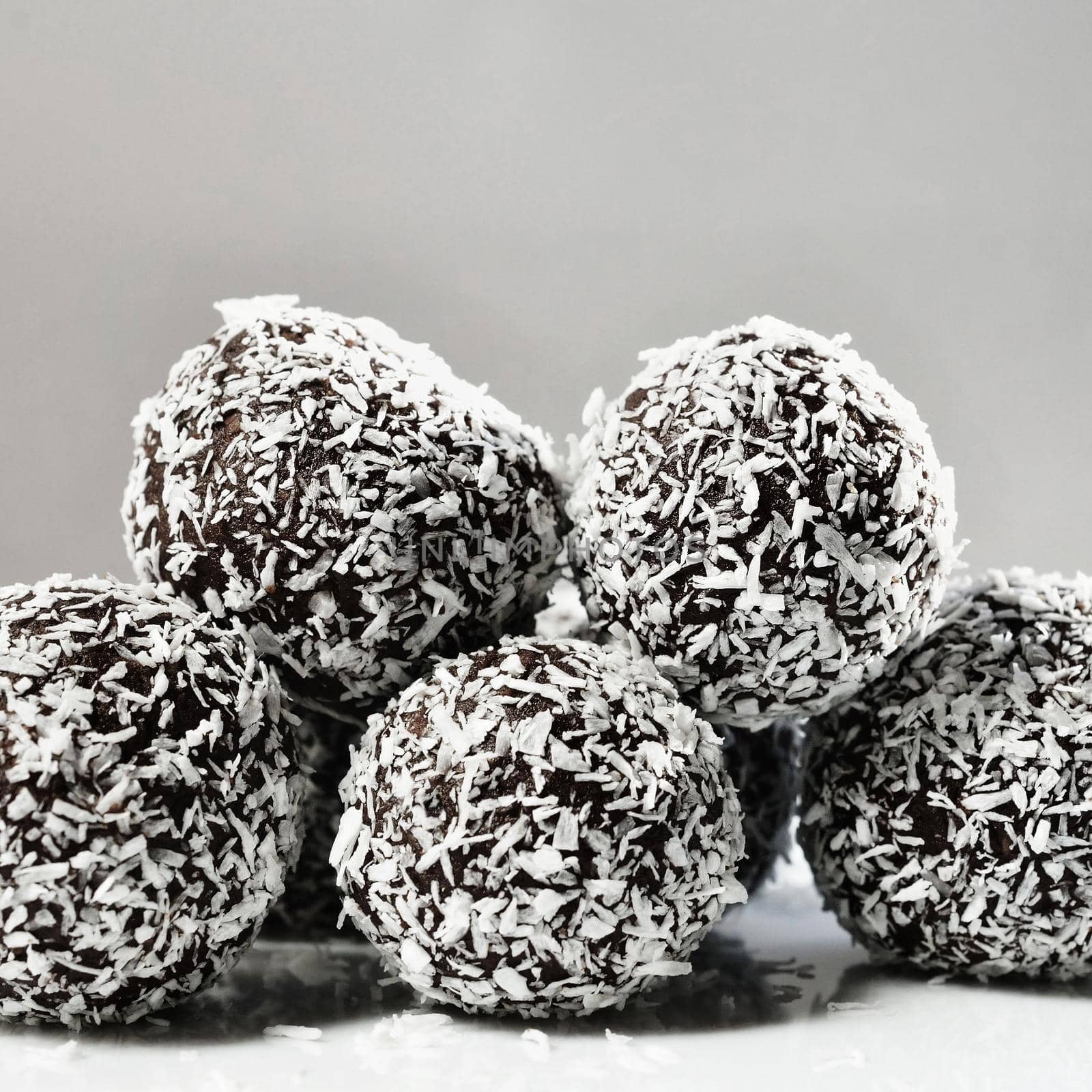 Homemade coconut rum balls on plate. Christmas sweets. Traditional homemade handmade Czech sweets.